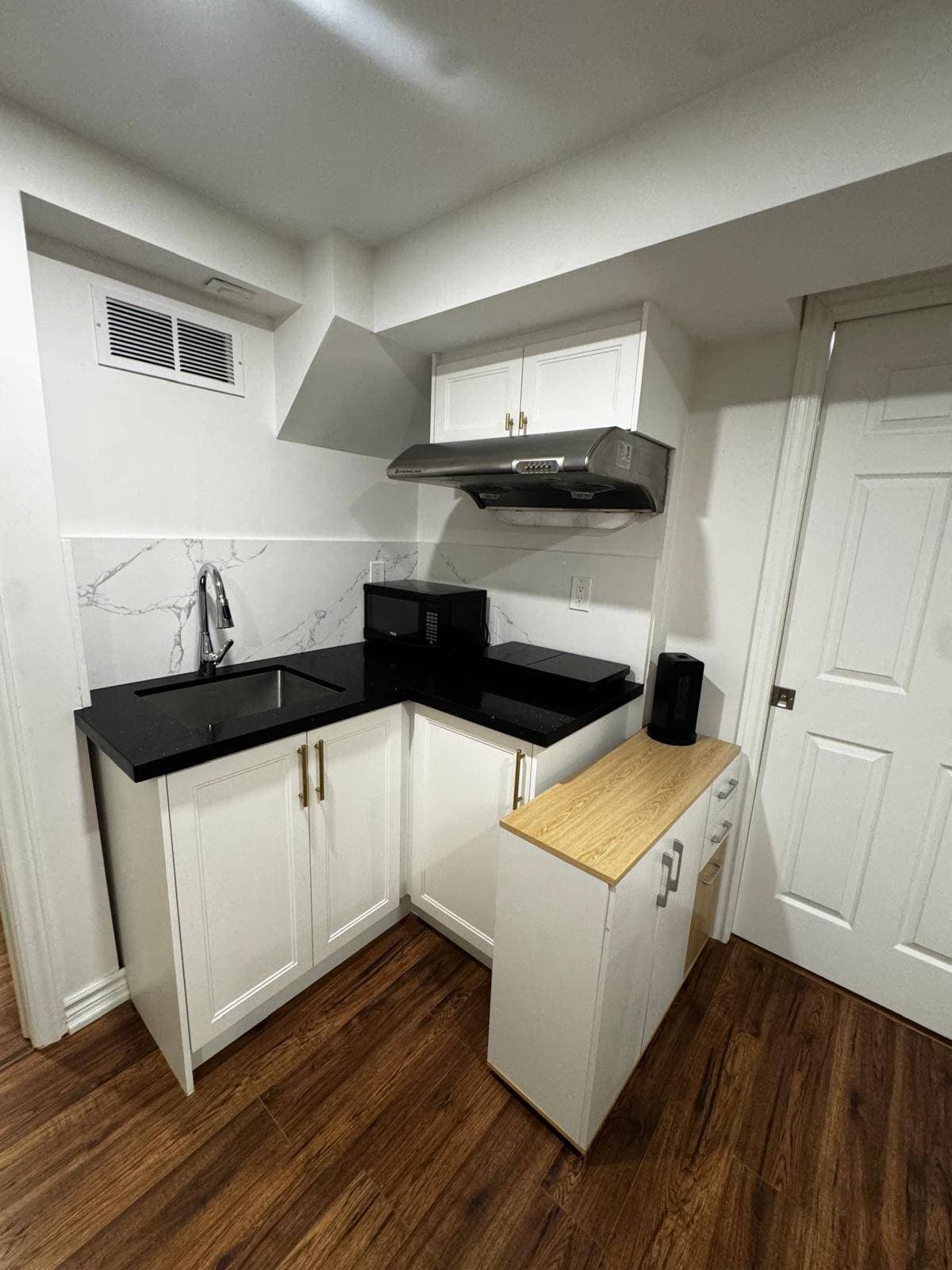 Modern Kitchen with Black Countertops at 4 Edison Way, Whitby, ON – 2 Bedroom Basement Apartment, a 2 bedroom rental in 4 Edison Way, Whitby, ON, listed for $1,600 per month
