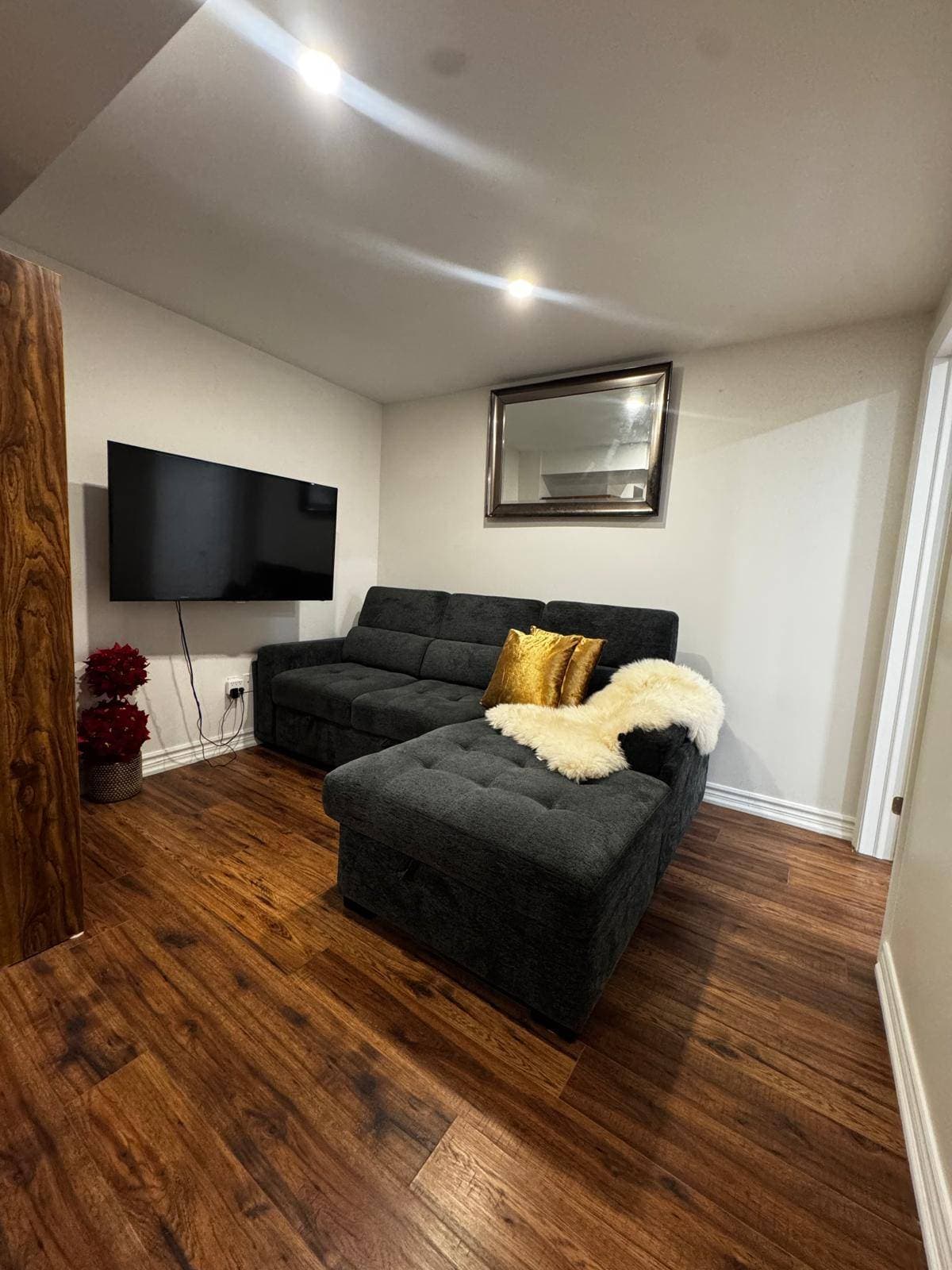 Cozy Living Room with Modern Décor at 4 Edison Way, Whitby, ON – 2 Bedroom Basement Apartment, a 2 bedroom rental in 4 Edison Way, Whitby, ON, listed for $1,600 per month