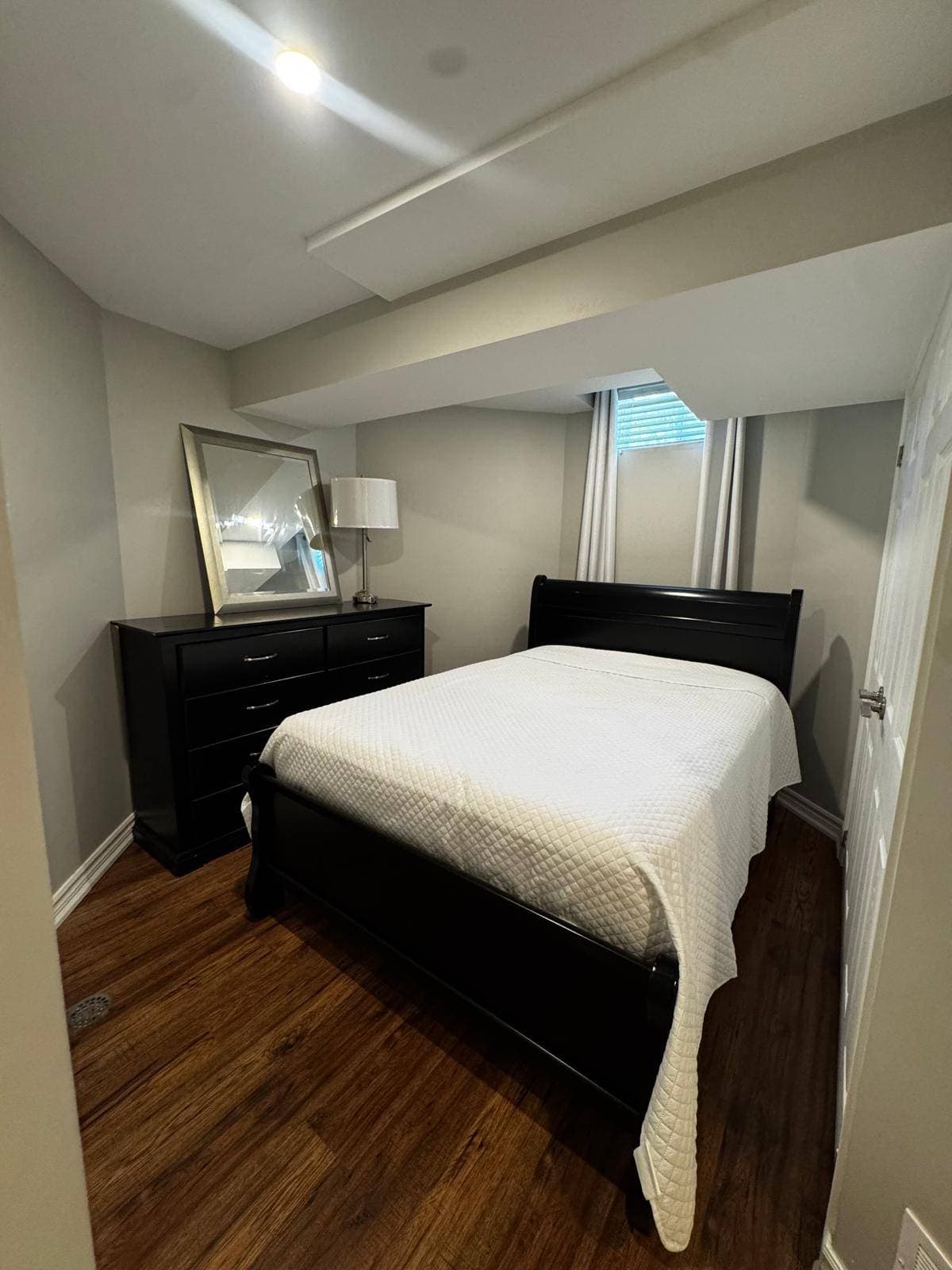 Cozy Bedroom with Modern Furnishings at 4 Edison Way, Whitby, ON – 2 Bedroom Basement Apartment, a 2 bedroom rental in 4 Edison Way, Whitby, ON, listed for $1,600 per month