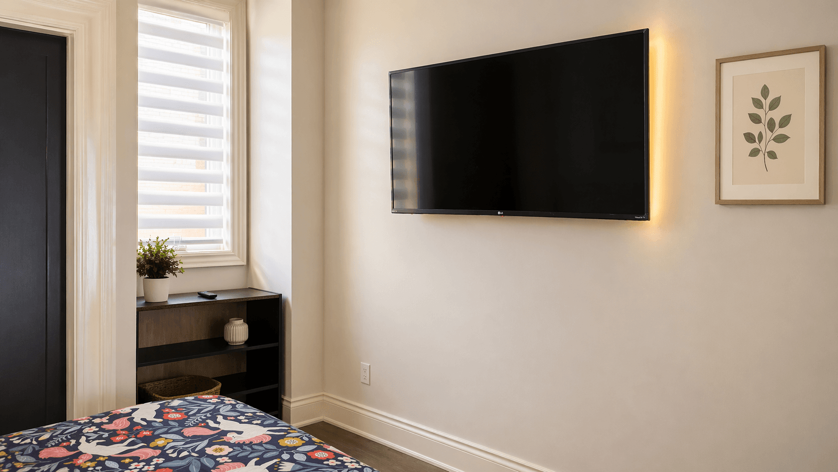Cozy Bedroom with TV and Plants at Modern Studio Apartment in Ancaster – 424 Springbrook Avenue, a 1 bedroom rental in 424 Springbrook Avenue, Hamilton, ON, listed for $1,200 per month