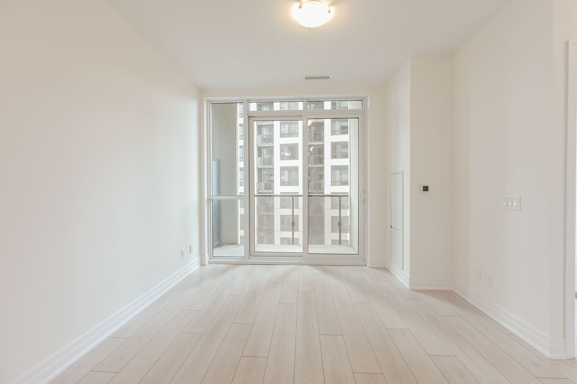 Bright Living Area with Balcony Access at Rental Listing in Mississauga, a 2 bedroom rental in 30 Elm Drive West, Mississauga, ON, listed for $2,500 per month