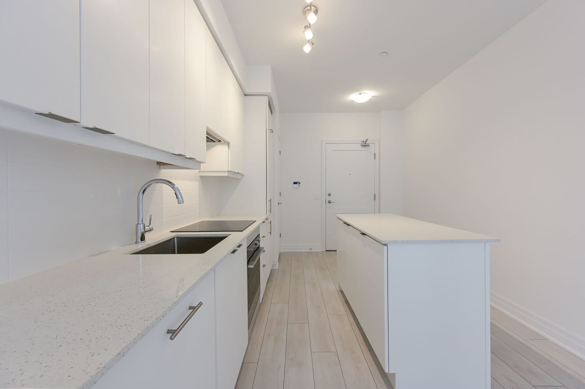 Modern Kitchen with White Cabinets at Rental Listing in Mississauga, a 2 bedroom rental in 30 Elm Drive West, Mississauga, ON, listed for $2,500 per month