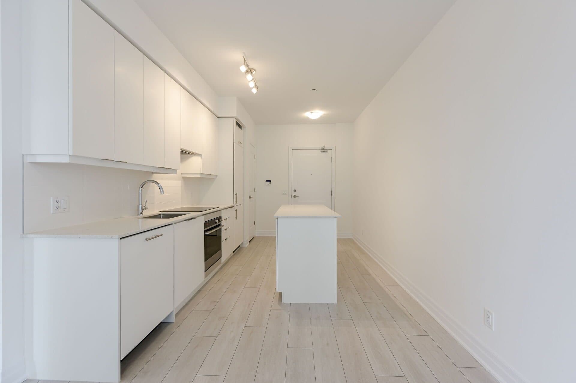Modern Kitchen with Island at Rental Listing in Mississauga, a 2 bedroom rental in 30 Elm Drive West, Mississauga, ON, listed for $2,500 per month