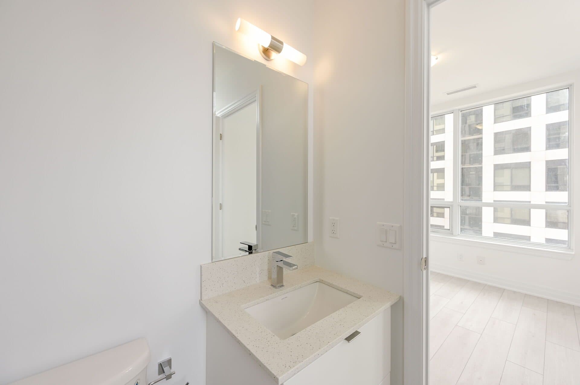 Modern Bathroom with Natural Lighting at Rental Listing in Mississauga, a 2 bedroom rental in 30 Elm Drive West, Mississauga, ON, listed for $2,500 per month