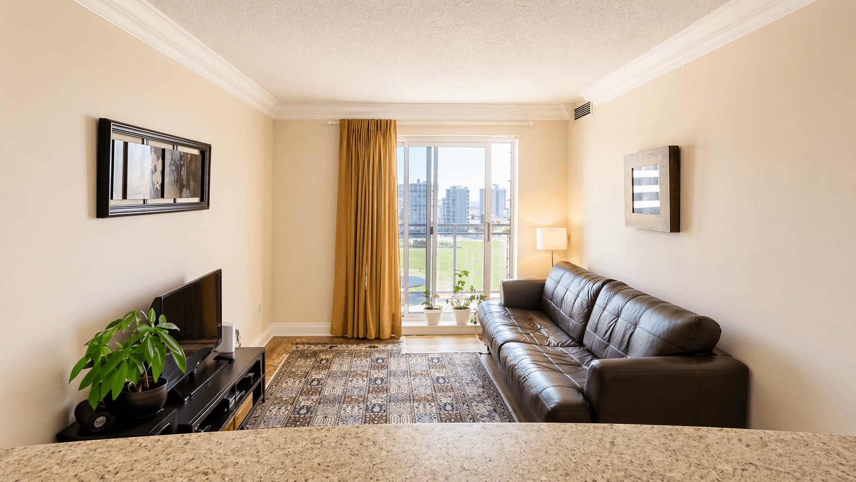Cozy Living Room with Window View at 1-Bedroom Condo in Prime Richmond Hill Location, a 1 bedroom rental in 39 Oneida Crescent, Richmond Hill, ON, listed for $2,075 per month