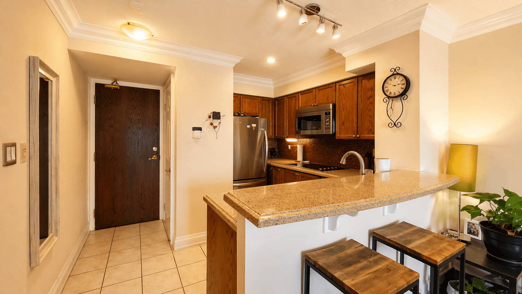 Cozy Kitchen with Breakfast Bar at 1-Bedroom Condo in Prime Richmond Hill Location, a 1 bedroom rental in 39 Oneida Crescent, Richmond Hill, ON, listed for $2,075 per month
