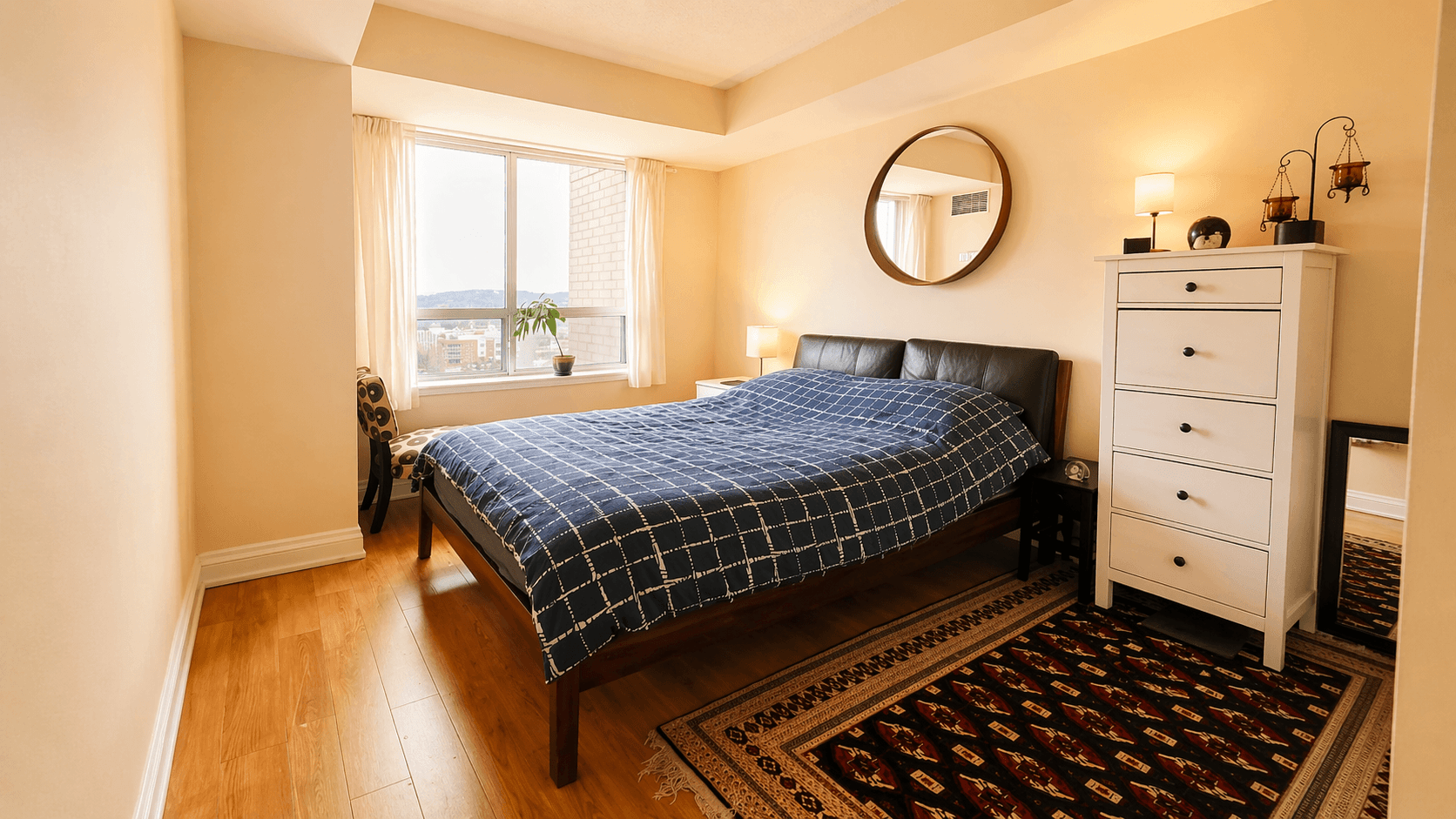 Cozy Primary Bedroom with Large Window at 1-Bedroom Condo in Prime Richmond Hill Location, a 1 bedroom rental in 39 Oneida Crescent, Richmond Hill, ON, listed for $2,075 per month