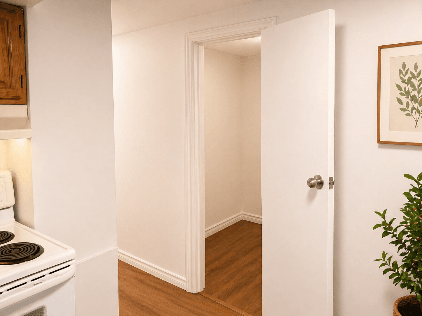 Kitchen Area with Entrance to Another Room at Modern 2-Bedroom Condo (Lower Level) in Hintonburg – Parking Included, a 2 bedroom rental in 210 Armstrong Street, Ottawa, ON, listed for $1,850 per month