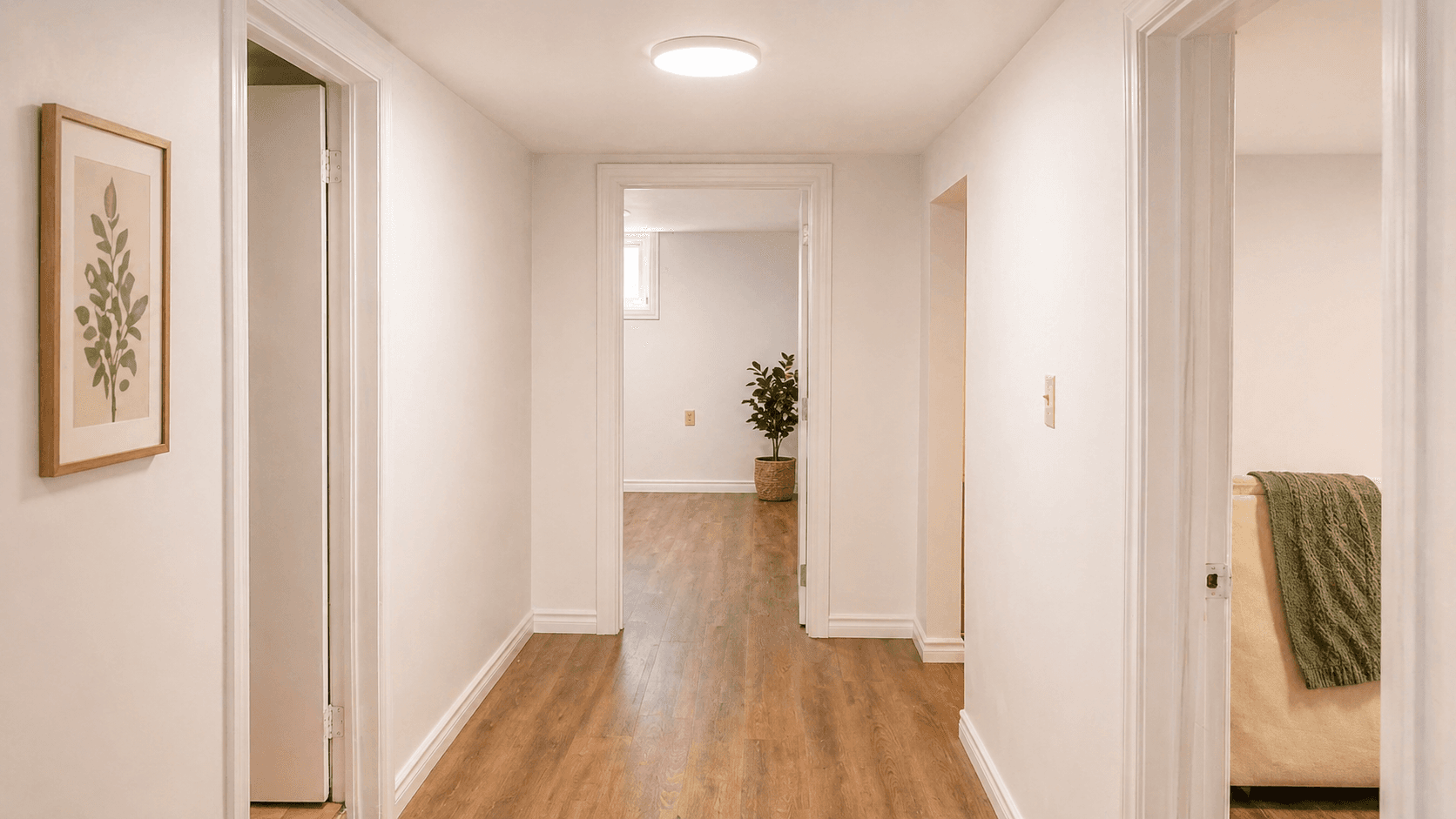 Interior Hallway with Doorways at Modern 2-Bedroom Condo (Lower Level) in Hintonburg – Parking Included, a 2 bedroom rental in 210 Armstrong Street, Ottawa, ON, listed for $1,850 per month