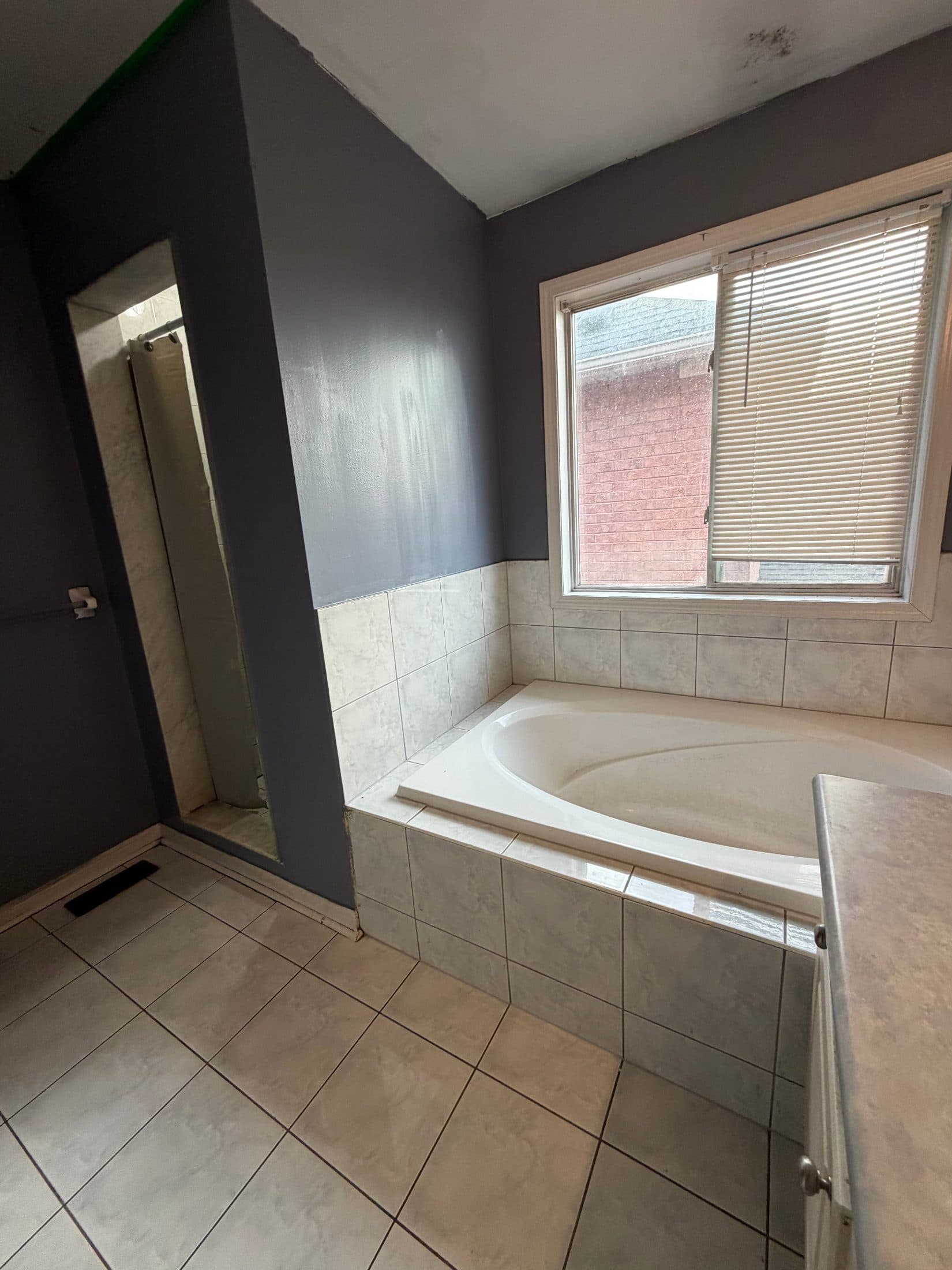 Bathroom with Bathtub and Window at Spacious 4 Bedroom Detached Home for Rent in Brampton – 85 Herdwick Street, a 4 bedroom rental in 85 Herdwick Street, Brampton, ON, listed for $3,250 per month