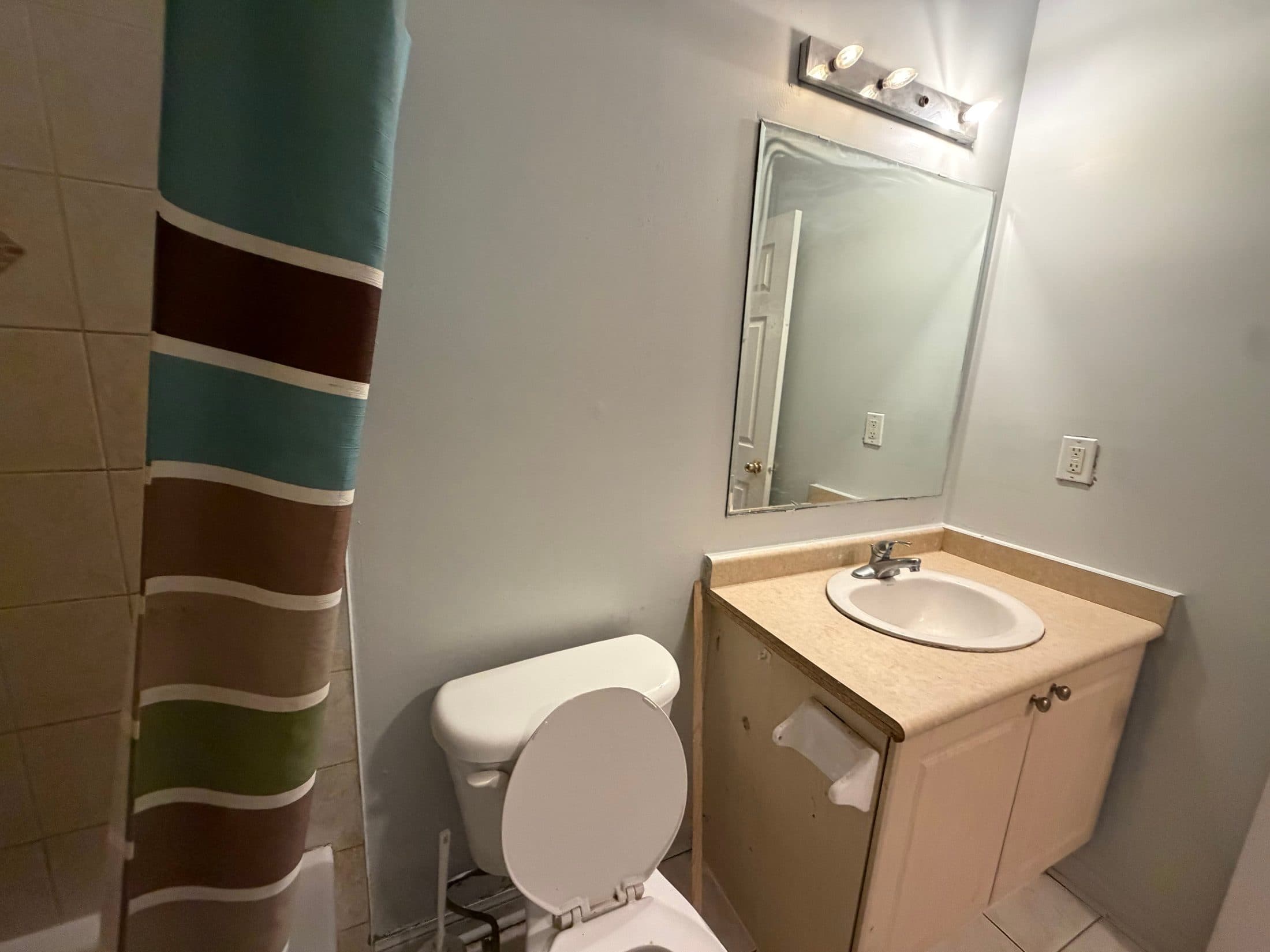 Compact Bathroom with Shower and Sink at Spacious 4 Bedroom Detached Home for Rent in Brampton – 85 Herdwick Street, a 4 bedroom rental in 85 Herdwick Street, Brampton, ON, listed for $3,250 per month