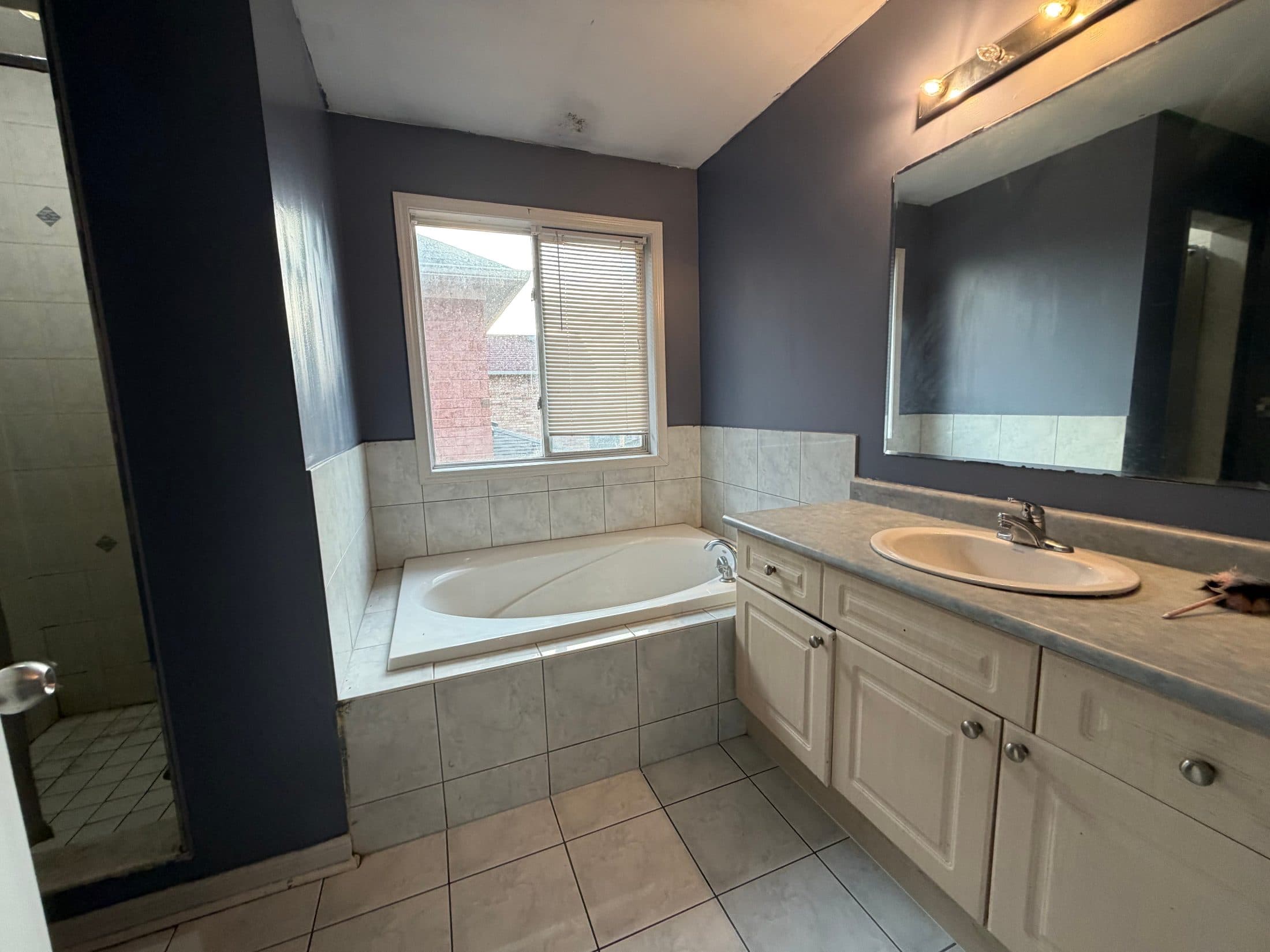 Spacious Bathroom with Tub and Vanity at Spacious 4 Bedroom Detached Home for Rent in Brampton – 85 Herdwick Street, a 4 bedroom rental in 85 Herdwick Street, Brampton, ON, listed for $3,250 per month
