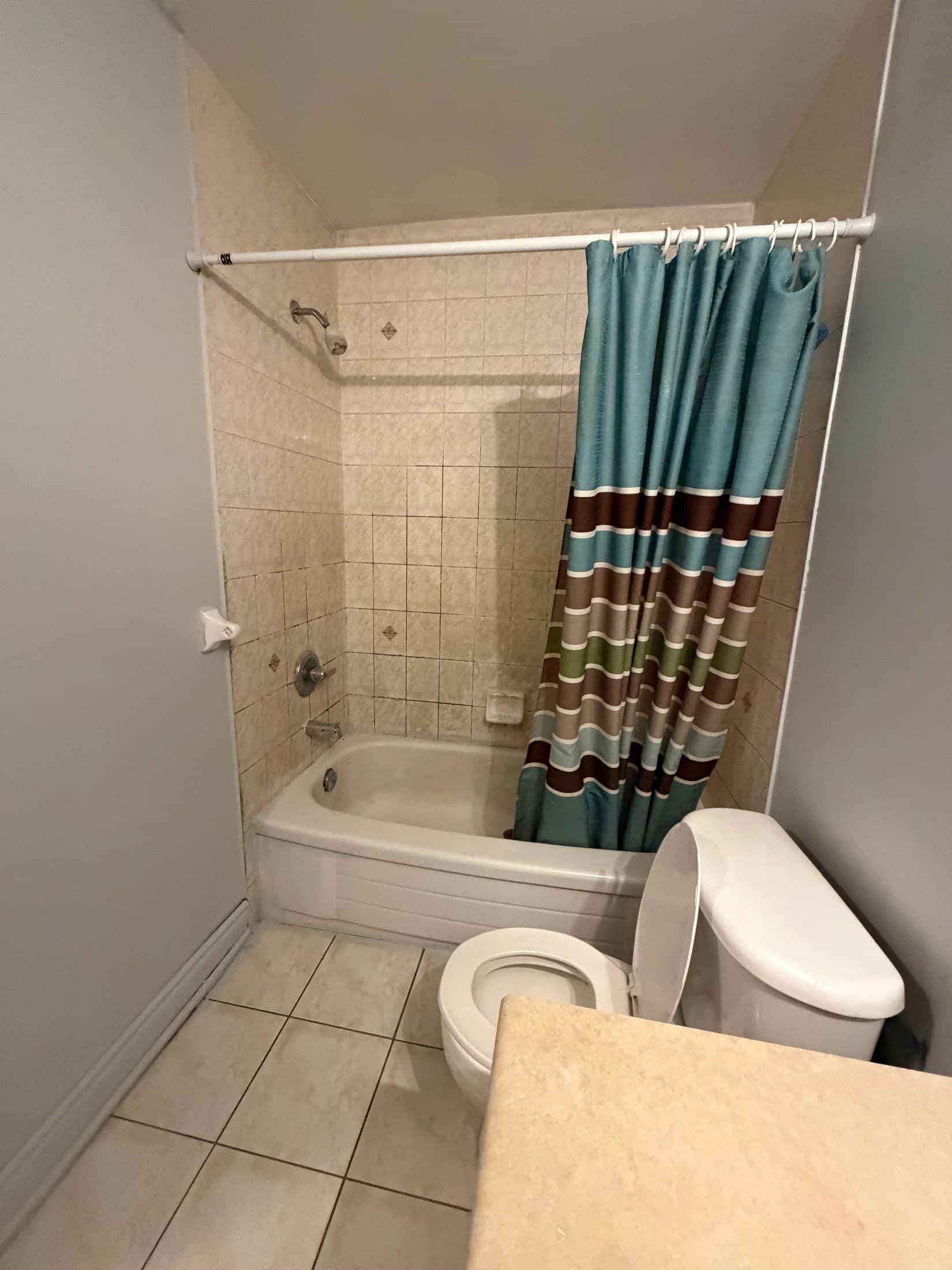 Bathroom with Shower and Tub at Spacious 4 Bedroom Detached Home for Rent in Brampton – 85 Herdwick Street, a 4 bedroom rental in 85 Herdwick Street, Brampton, ON, listed for $3,250 per month