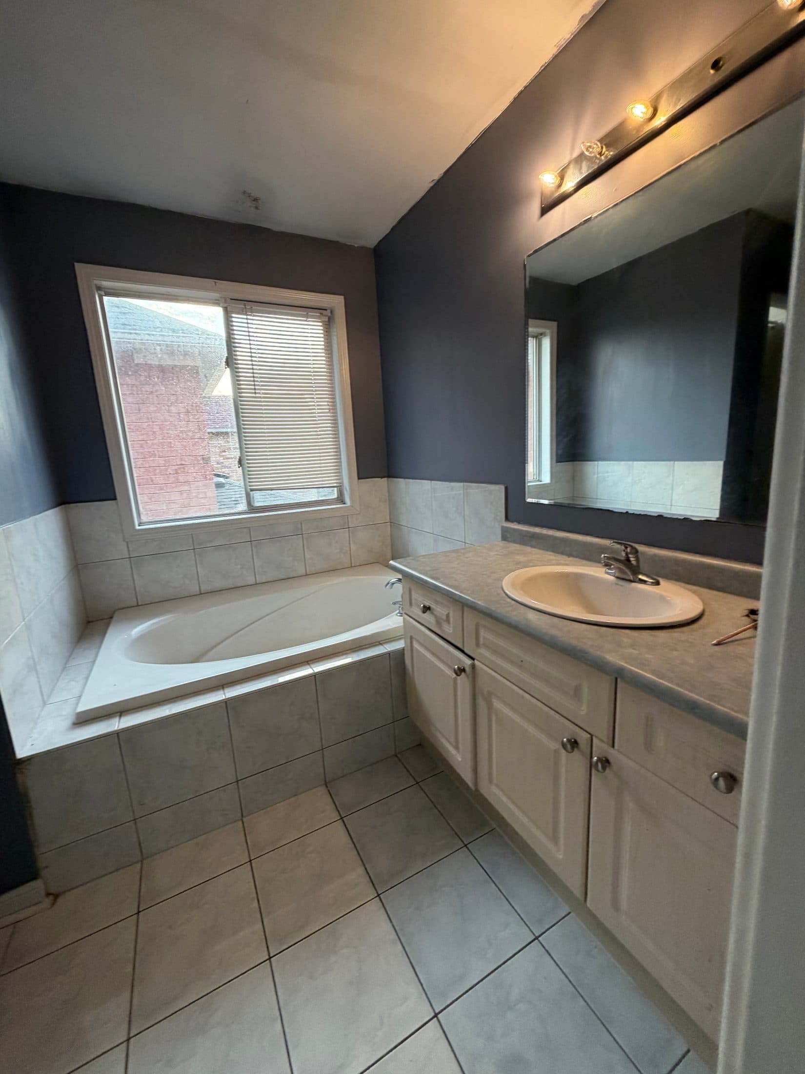 Spacious Bathroom with Tub and Sink at Spacious 4 Bedroom Detached Home for Rent in Brampton – 85 Herdwick Street, a 4 bedroom rental in 85 Herdwick Street, Brampton, ON, listed for $3,250 per month