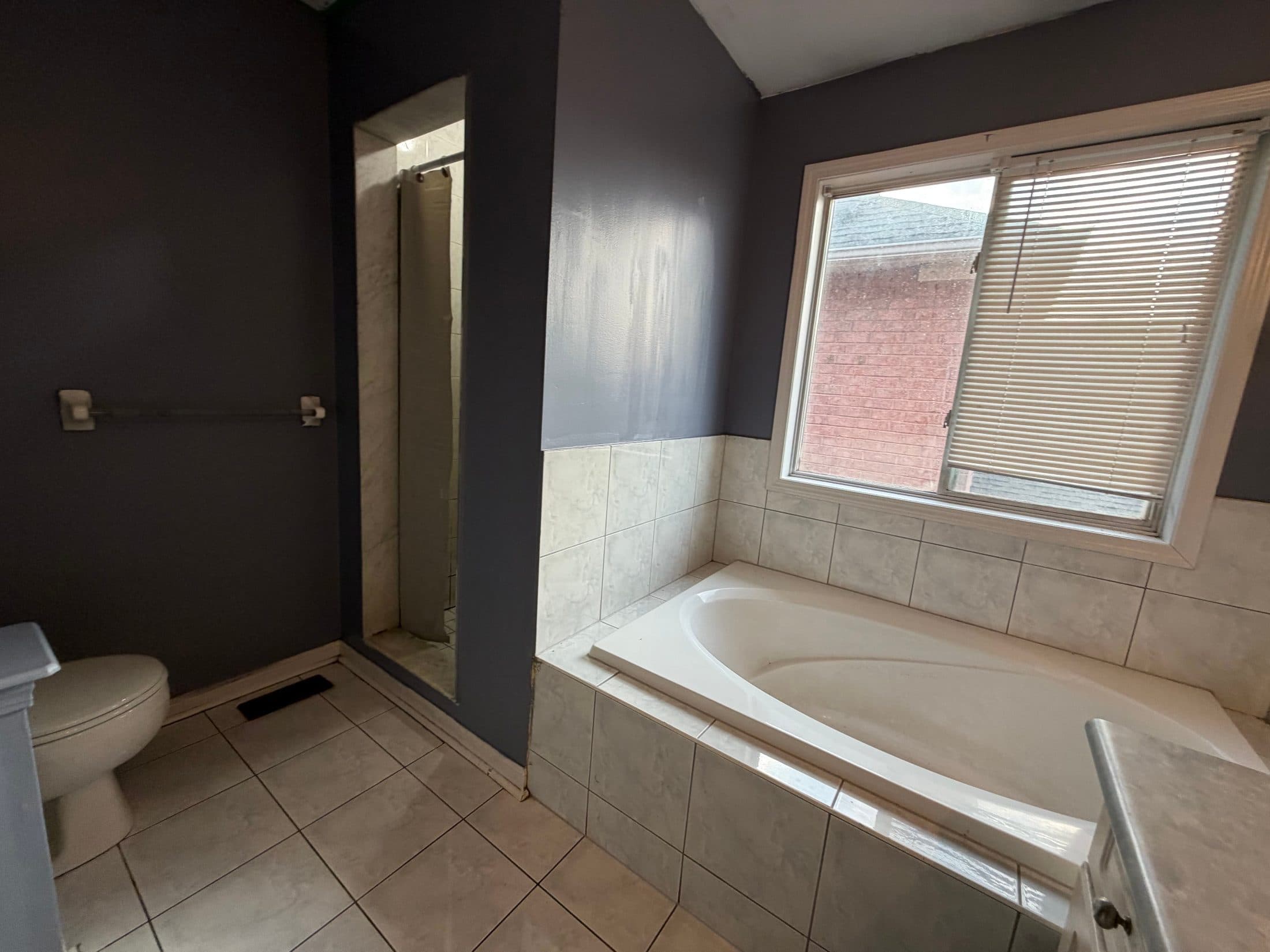 Bathroom with Shower and Bathtub at Spacious 4 Bedroom Detached Home for Rent in Brampton – 85 Herdwick Street, a 4 bedroom rental in 85 Herdwick Street, Brampton, ON, listed for $3,250 per month
