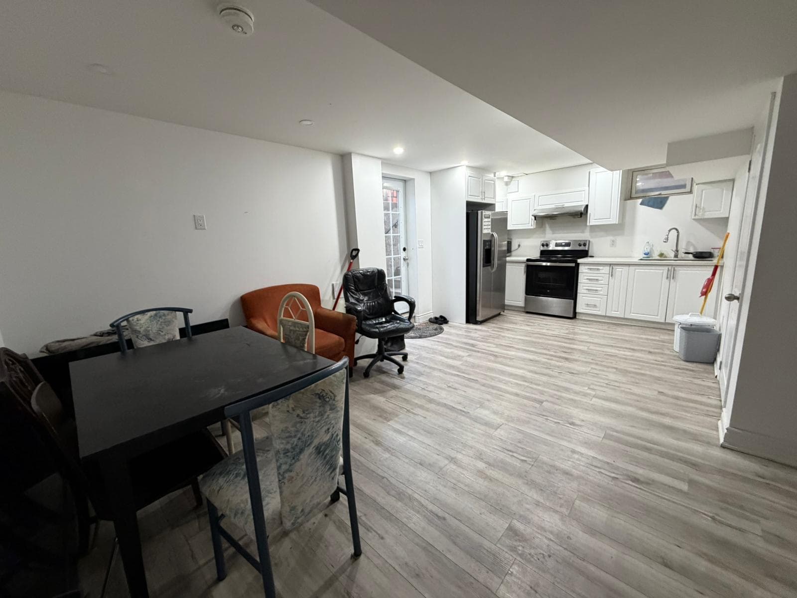 Modern kitchen with dining area at Spacious Private Room in 4 Bed Basement., a 1 bedroom rental in 48 Maddybeth Crescent, Brampton, ON, listed for $850 per month