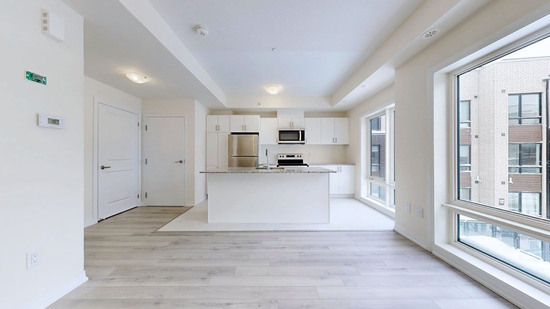 Modern Kitchen with Open Layout at Rental Listing in Scarborough, a 1 bedroom rental in 165 Tapscott Road, Scarborough, ON, listed for $1,000 per month