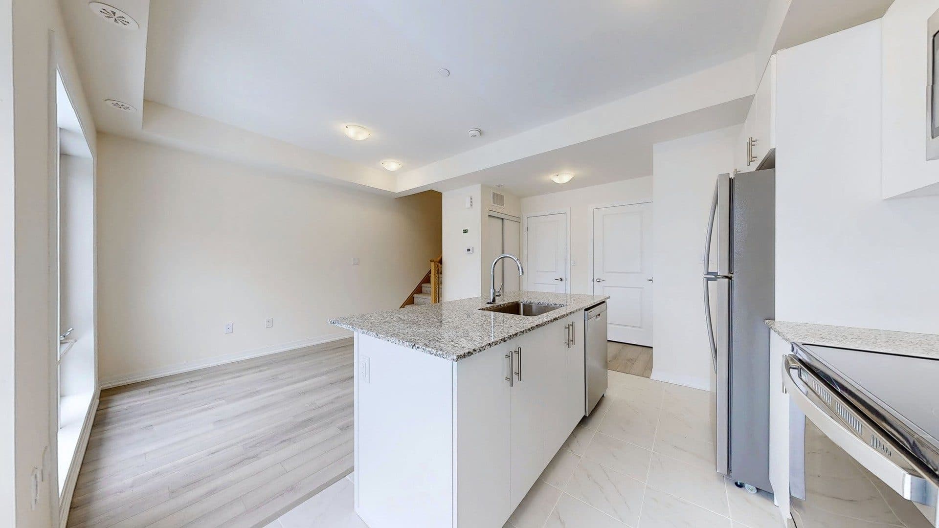 Modern Kitchen with Island at Rental Listing in Scarborough, a 1 bedroom rental in 165 Tapscott Road, Scarborough, ON, listed for $1,000 per month