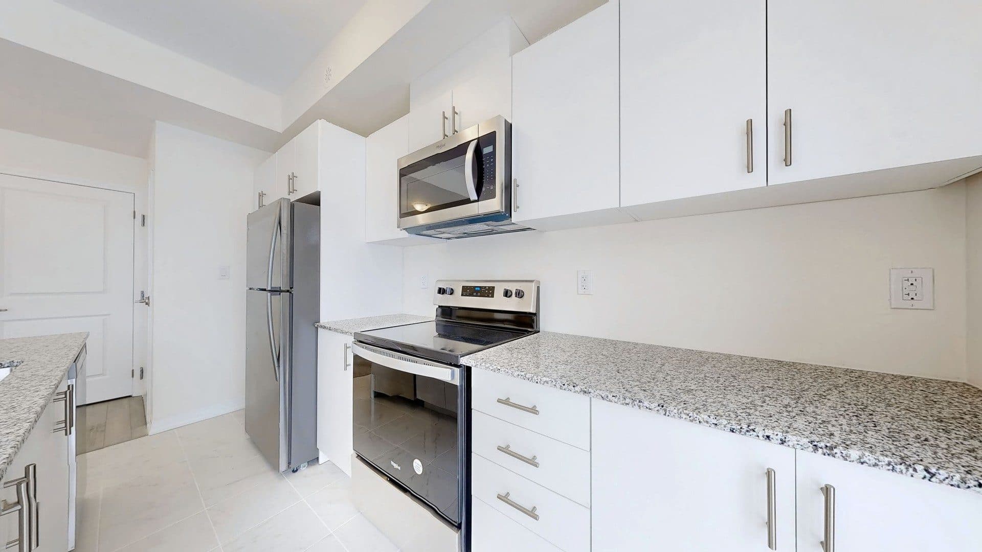 Modern Kitchen with Stainless Appliances at Rental Listing in Scarborough, a 1 bedroom rental in 165 Tapscott Road, Scarborough, ON, listed for $1,000 per month