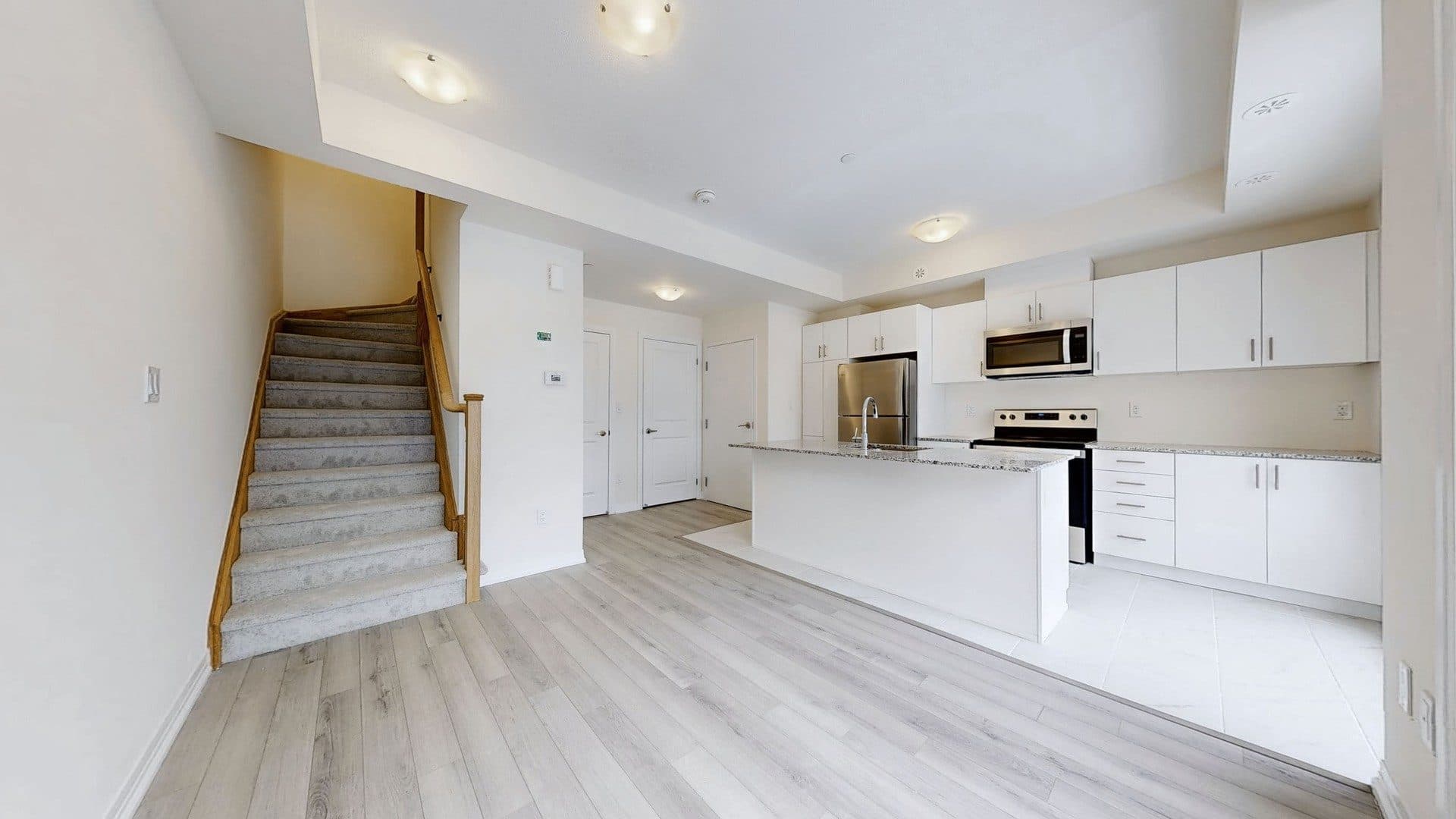Modern Kitchen with Open Layout at Rental Listing in Scarborough, a 1 bedroom rental in 165 Tapscott Road, Scarborough, ON, listed for $1,000 per month