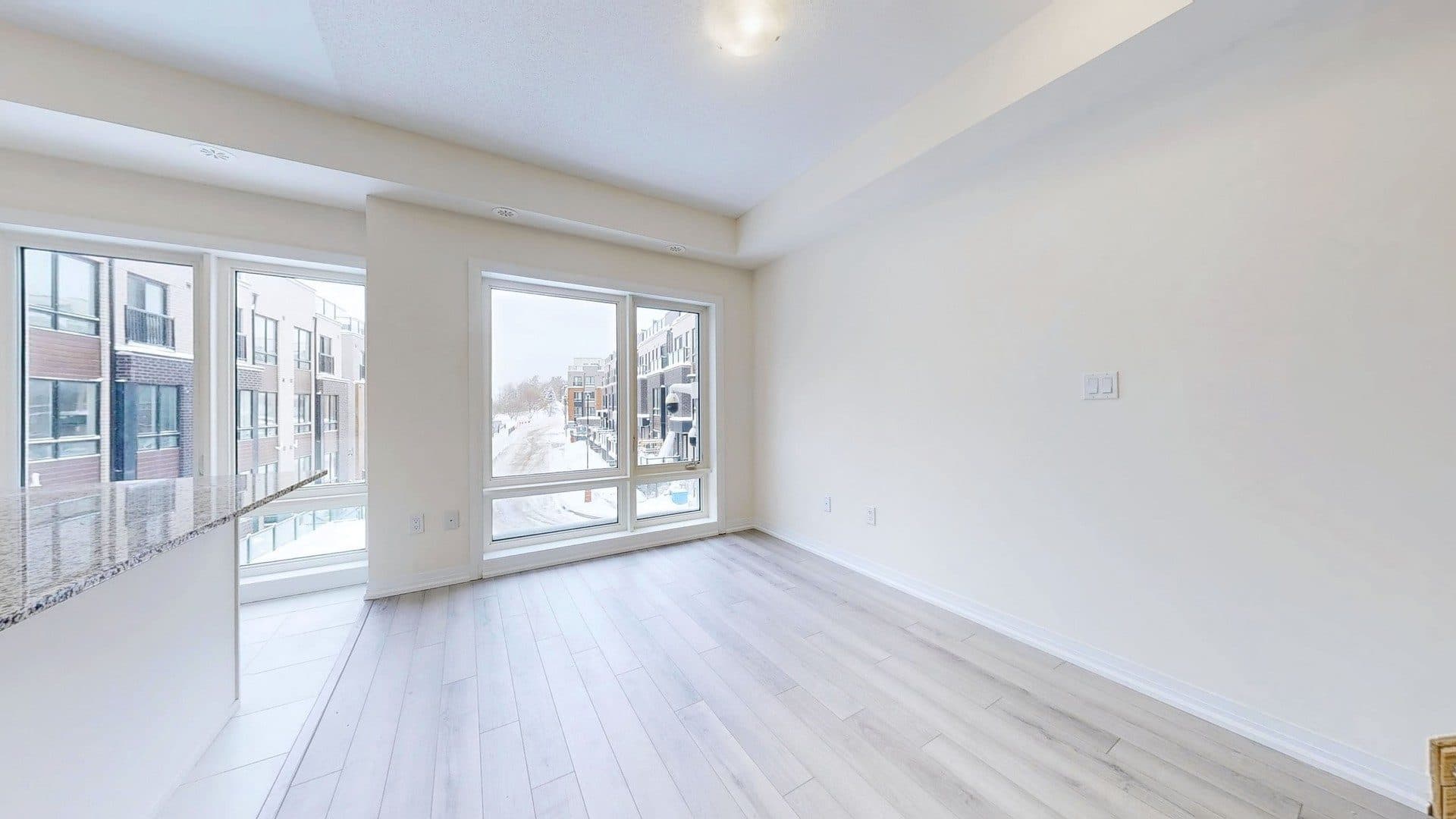 Bright Living Room with Large Windows at Rental Listing in Scarborough, a 1 bedroom rental in 165 Tapscott Road, Scarborough, ON, listed for $1,000 per month