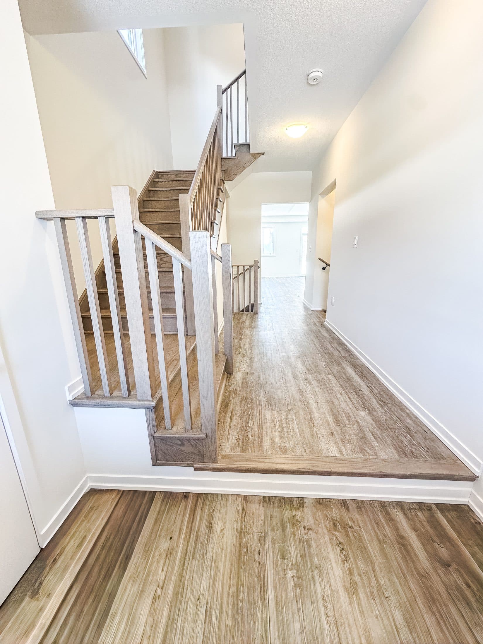 Modern Entryway with Stairs at 1 Bedroom Townhouse in Oshawa for $1,200, a 1 bedroom rental in 2004 Horace Duncan Crescent, Oshawa, ON, listed for $1,200 per month
