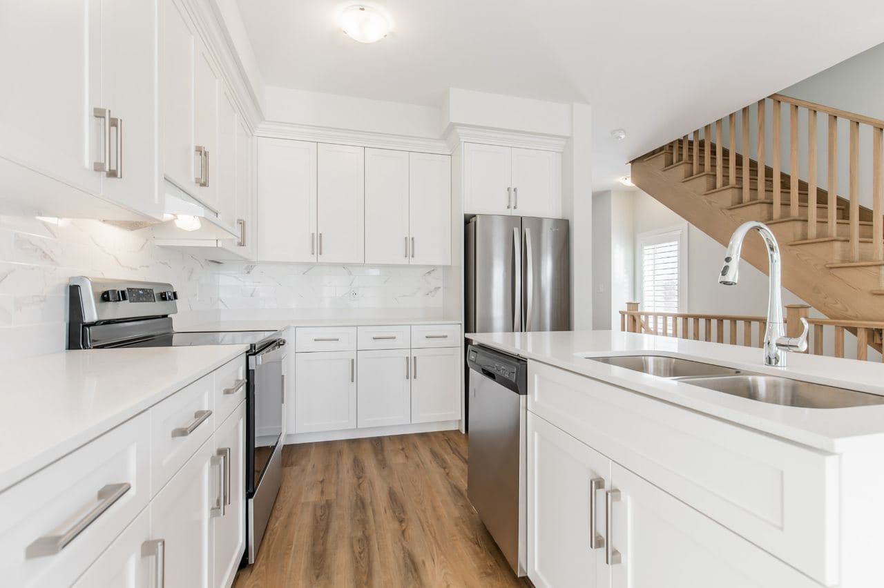 Modern White Kitchen Interior at A cozy Bedroom in 4 Bedroom House, a 1 bedroom rental in 23 BayBerry Lane, Hamilton, ON, listed for $800 per month
