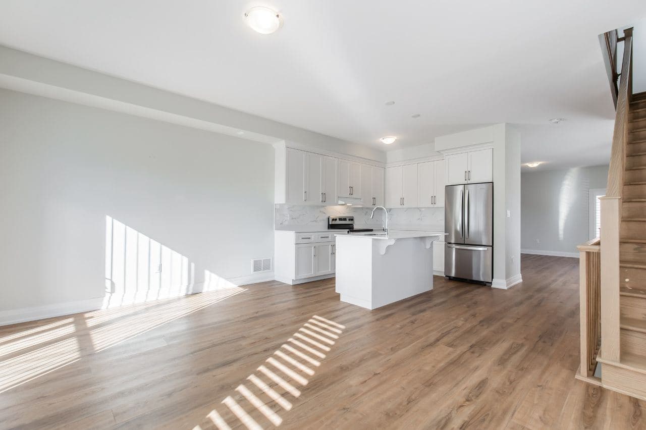 Modern Kitchen with Island and Appliances at A cozy Bedroom in 4 Bedroom House, a 1 bedroom rental in 23 BayBerry Lane, Hamilton, ON, listed for $800 per month