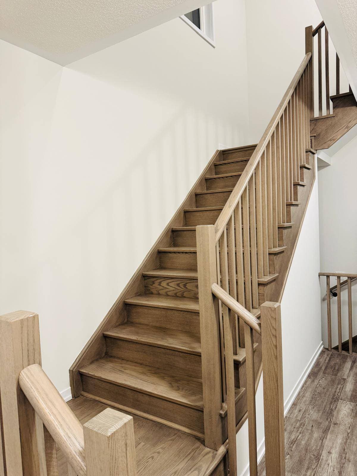 Interior Stairs with Wood Railings at 1 Bedroom Townhouse in Oshawa for $800, a 1 bedroom rental in 2004 Horace Duncan Crescent, Oshawa, ON, listed for $800 per month
