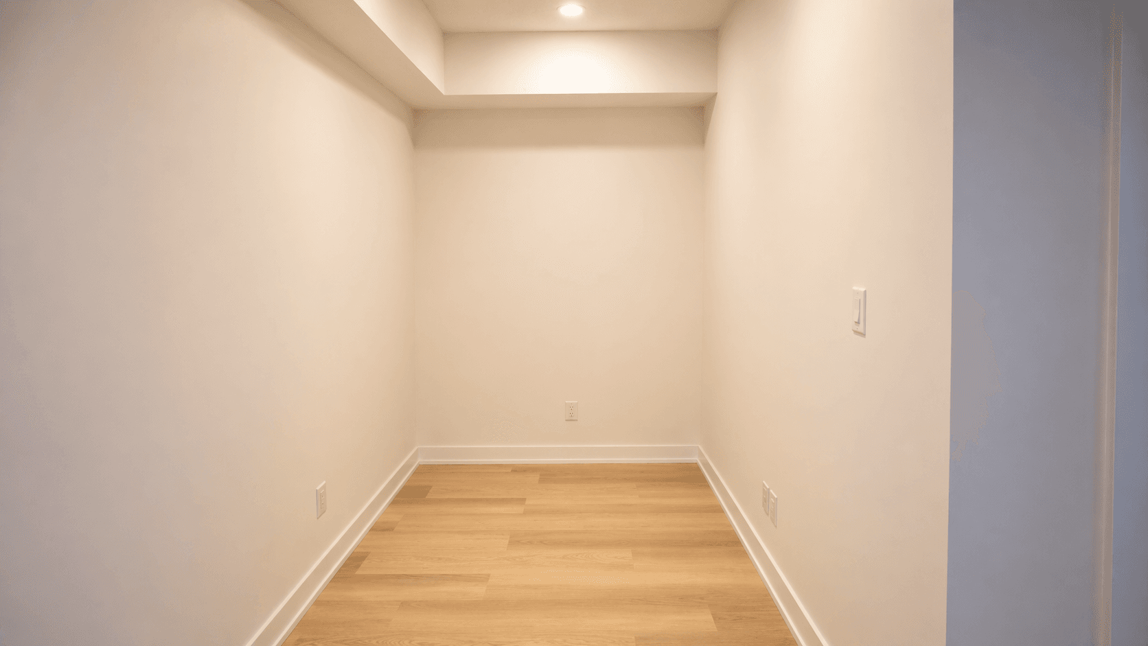 Empty Room with Wood Flooring at Yorkwoods Condos – 2839 Jane Street, Toronto, a 2 bedroom rental in 2839 Jane Street, North York, ON, listed for $2,300 per month