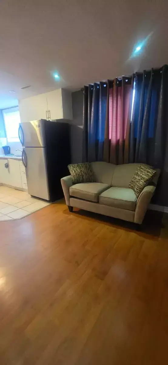 Cozy Living Room with Kitchen Access at 2 Bedroom Apartment in Brampton for $2,000, a 2 bedroom rental in 22 Iguana crescent, Brampton, ON, listed for $2,000 per month
