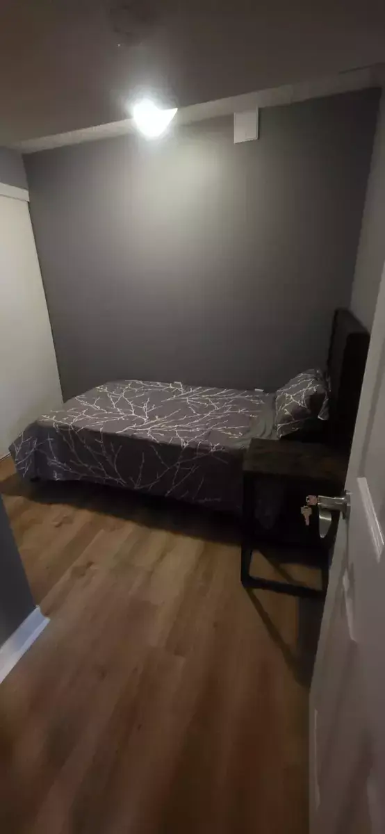 Cozy Guest Bedroom with Minimalist Decor at 2 Bedroom Apartment in Brampton for $2,000, a 2 bedroom rental in 22 Iguana crescent, Brampton, ON, listed for $2,000 per month