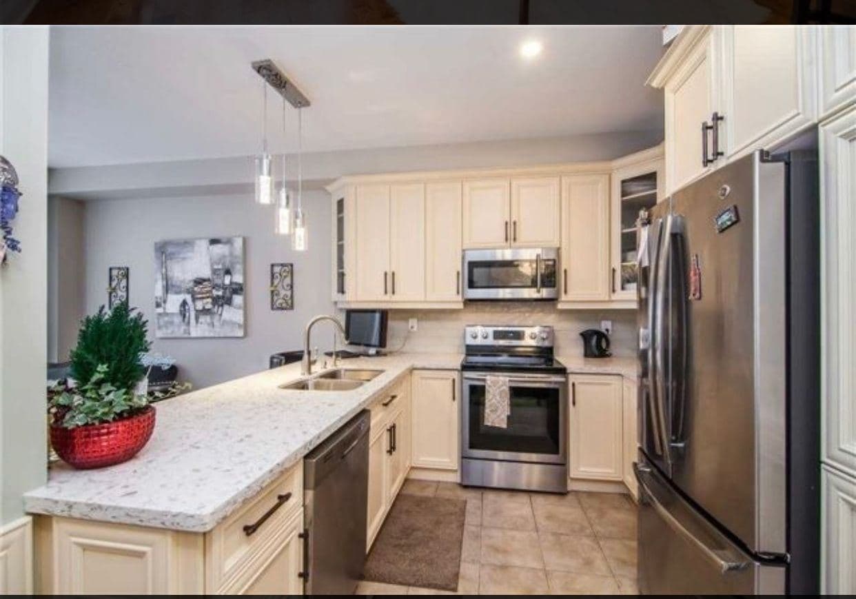Modern Kitchen with Stainless Steel Appliances at Spacious 4-Bedroom Detached Home for Rent – 25 Penny Royal Cres, Brampton, a 4 bedroom rental in 25 Pennyroyal Crescent, Brampton, ON, listed for $3,400 per month