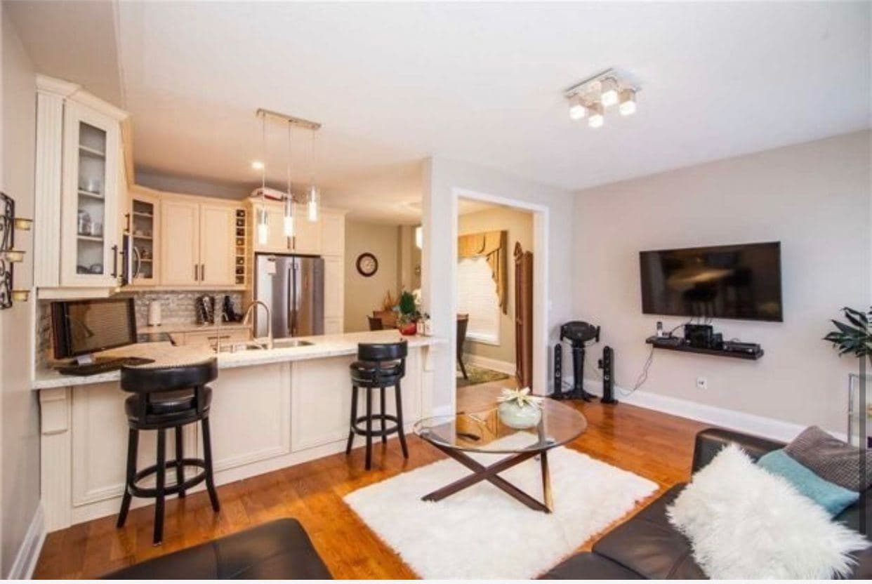 Cozy Living Room with Kitchen View at Spacious 4-Bedroom Detached Home for Rent – 25 Penny Royal Cres, Brampton, a 4 bedroom rental in 25 Pennyroyal Crescent, Brampton, ON, listed for $3,400 per month