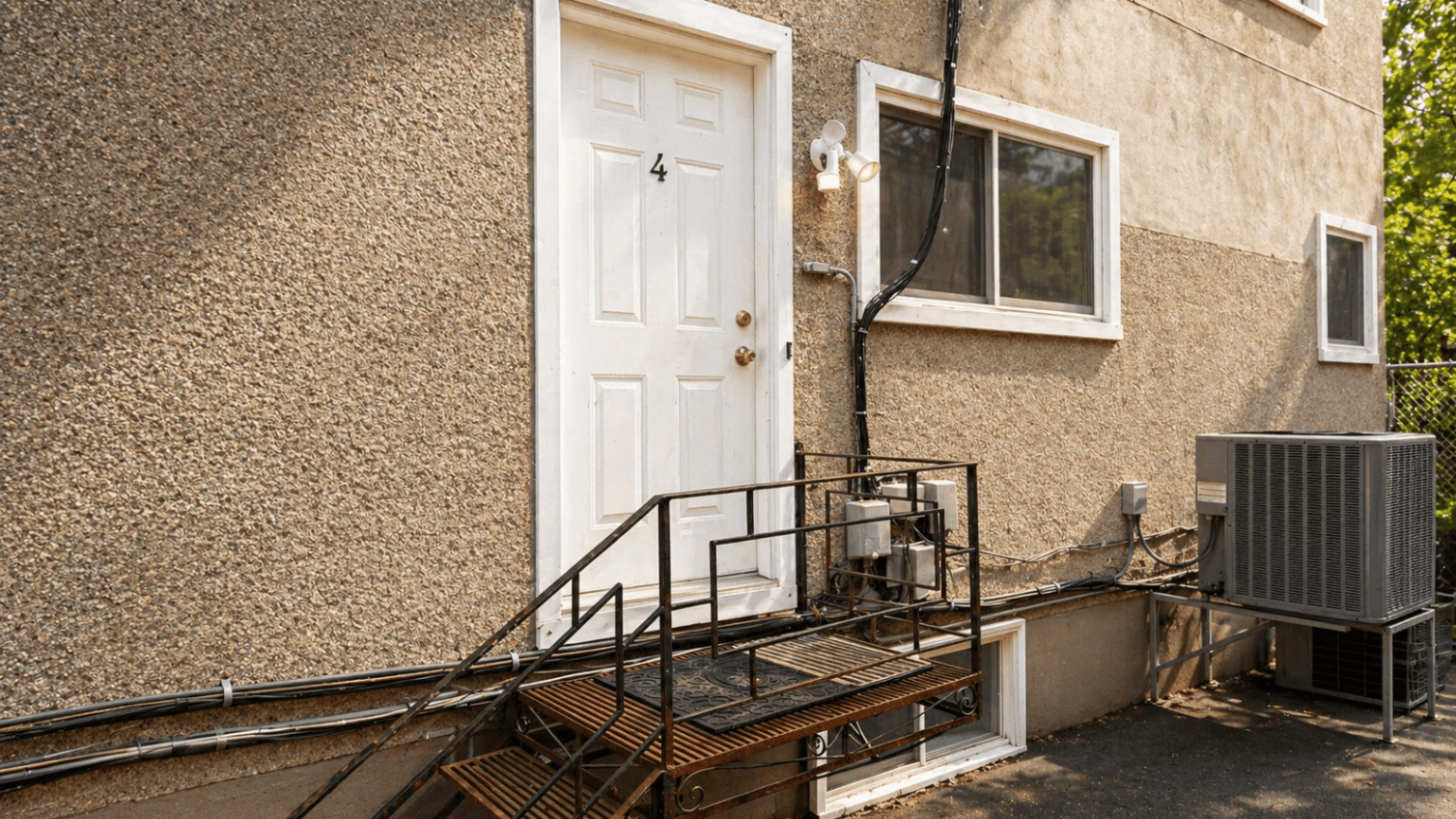 Back Entrance with Metal Staircase at Modern 1-Bedroom Condo in Hintonburg, Ottawa – Prime Location, a 1 bedroom rental in 210 Armstrong Street, Ottawa, ON, listed for $1,795 per month