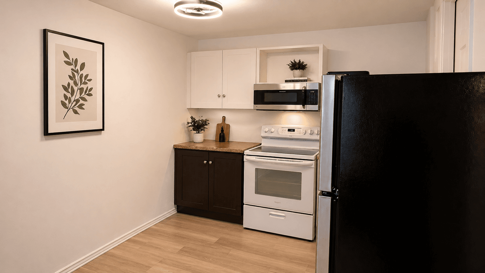 Modern Kitchen with Plants and Appliances at Modern 1-Bedroom Condo in Hintonburg, Ottawa – Prime Location, a 1 bedroom rental in 210 Armstrong Street, Ottawa, ON, listed for $1,795 per month