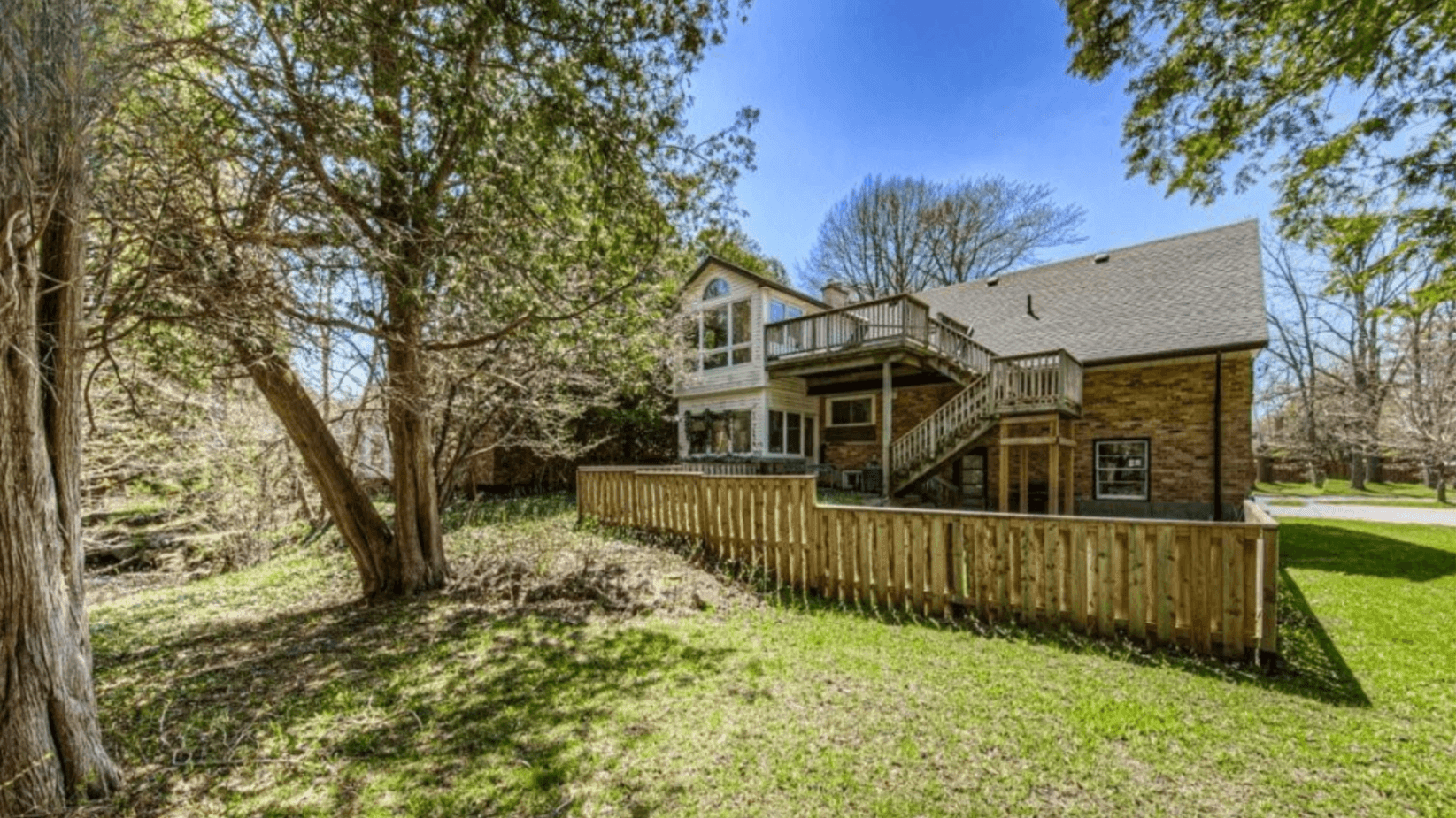 Backyard and Deck View at Rental Listing in Waterloo, a rental rental in 74 McDougall Road, Waterloo, ON, listed for $6,000 per month