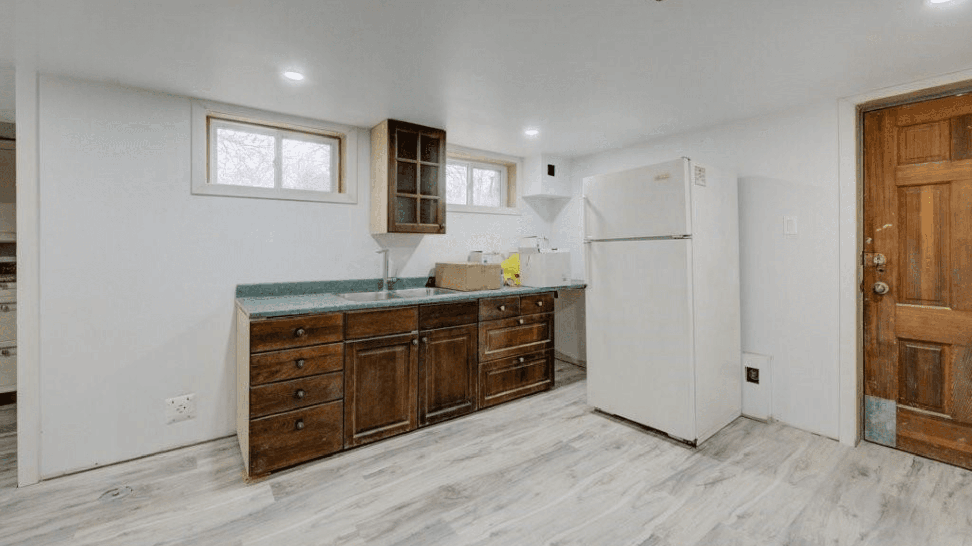 Compact Kitchen with Wooden Cabinets at Rental Listing in Waterloo, a rental rental in 74 McDougall Road, Waterloo, ON, listed for $6,000 per month