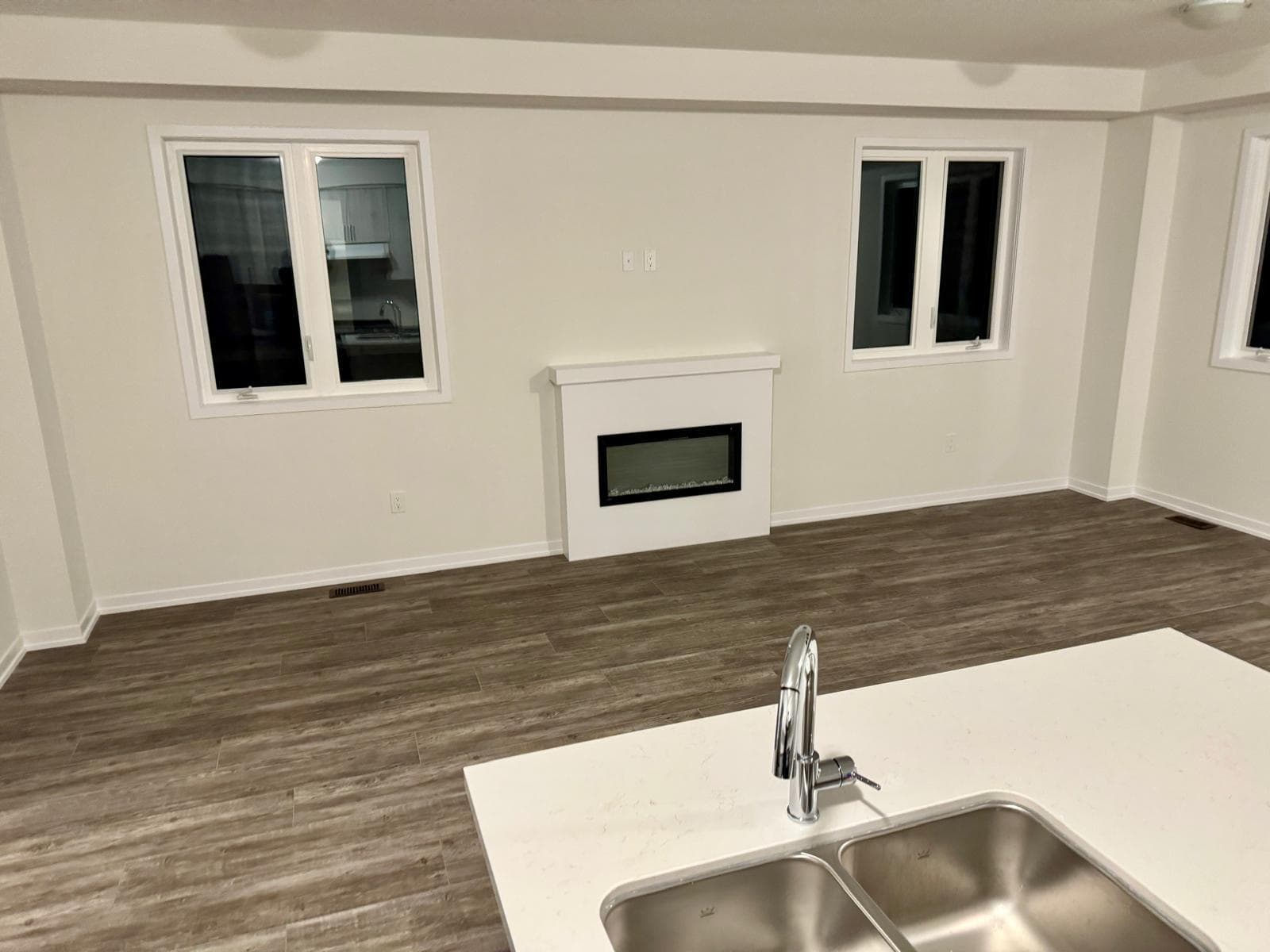 Bright Living Room with Fireplace at 1 Bedroom Townhouse in Oshawa for $700, a 1 bedroom rental in 2004 Horace Duncan Crescent, Oshawa, ON, listed for $700 per month