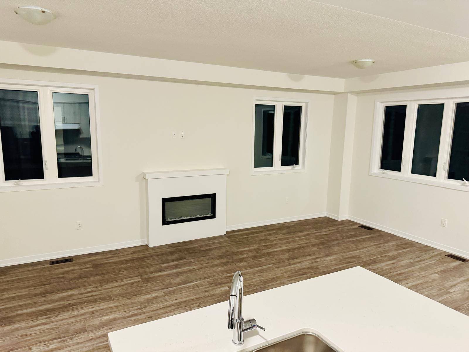 Spacious Living Room with Fireplace at 1 Bedroom Townhouse in Oshawa for $700, a 1 bedroom rental in 2004 Horace Duncan Crescent, Oshawa, ON, listed for $700 per month