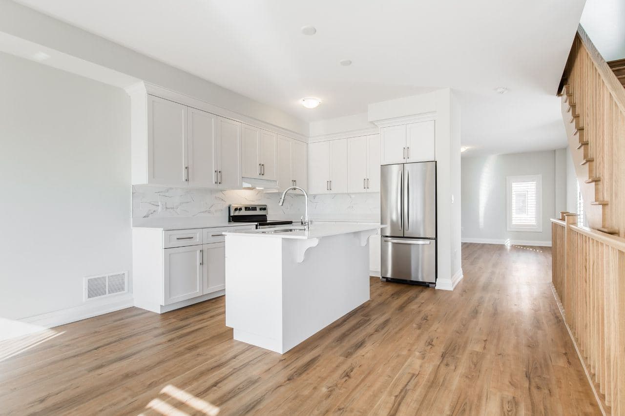 Modern Kitchen with Island and Stainless Steel Appliances at Private Room in Shared Townhouse – 23 Bayberry Lane, Hamilton, a 4 bedroom rental in 23 BayBerry Lane, Hamilton, ON, listed for $800 per month