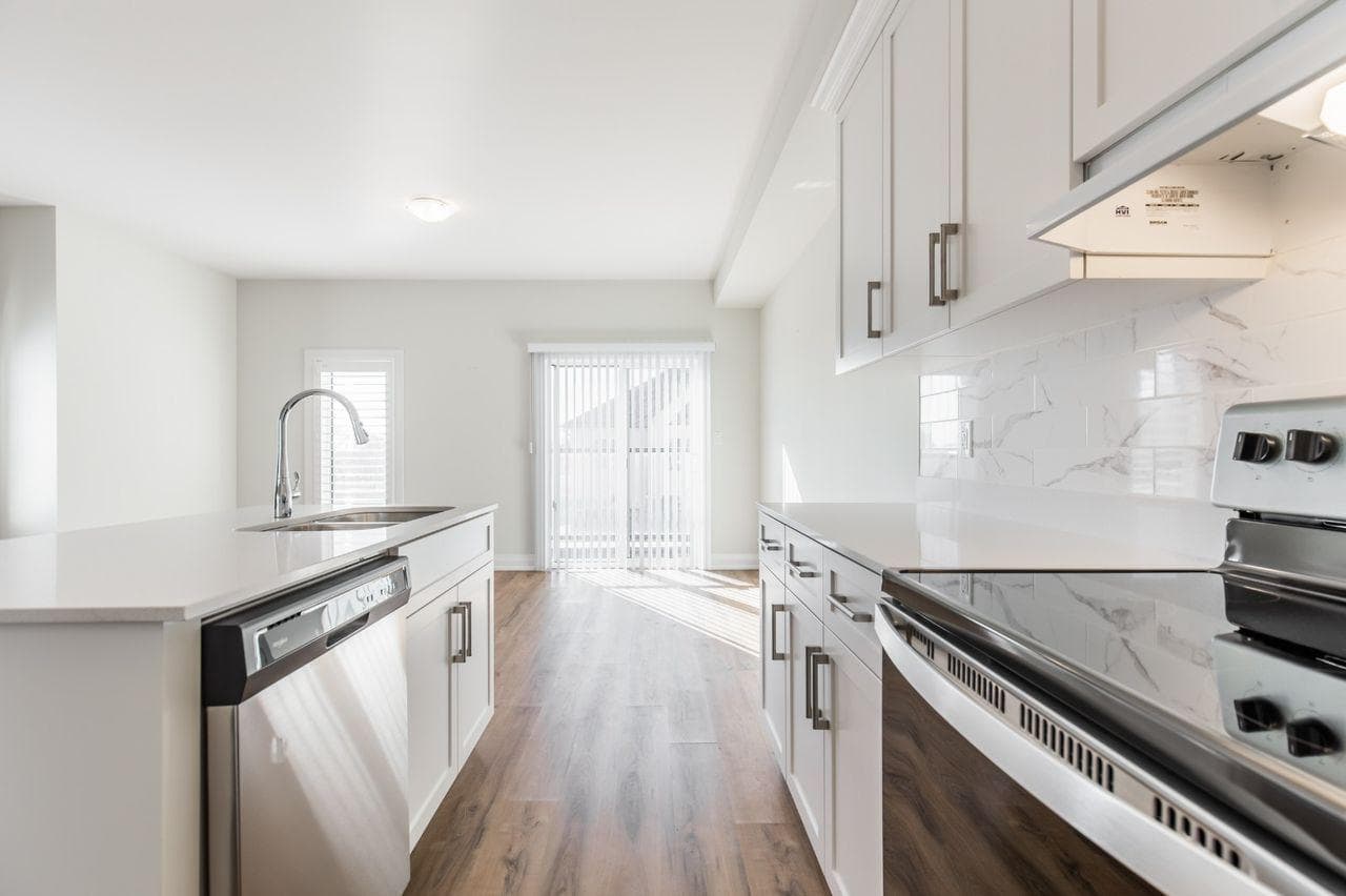 Modern Kitchen with Stainless Steel Appliances at Private Room in Shared Townhouse – 23 Bayberry Lane, Hamilton, a 4 bedroom rental in 23 BayBerry Lane, Hamilton, ON, listed for $800 per month