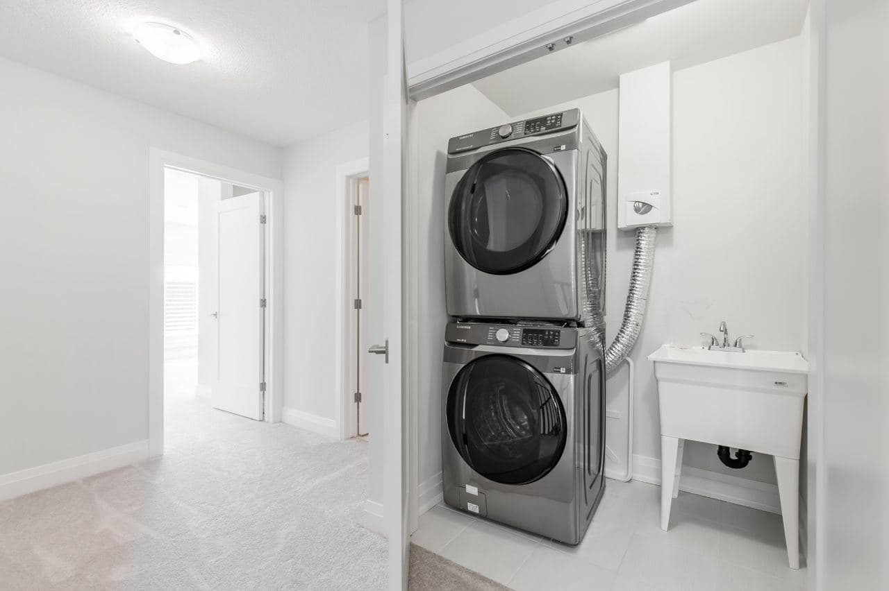 Modern Laundry Room with Washer and Utility Sink at Private Room in Shared Townhouse – 23 Bayberry Lane, Hamilton, a 4 bedroom rental in 23 BayBerry Lane, Hamilton, ON, listed for $800 per month