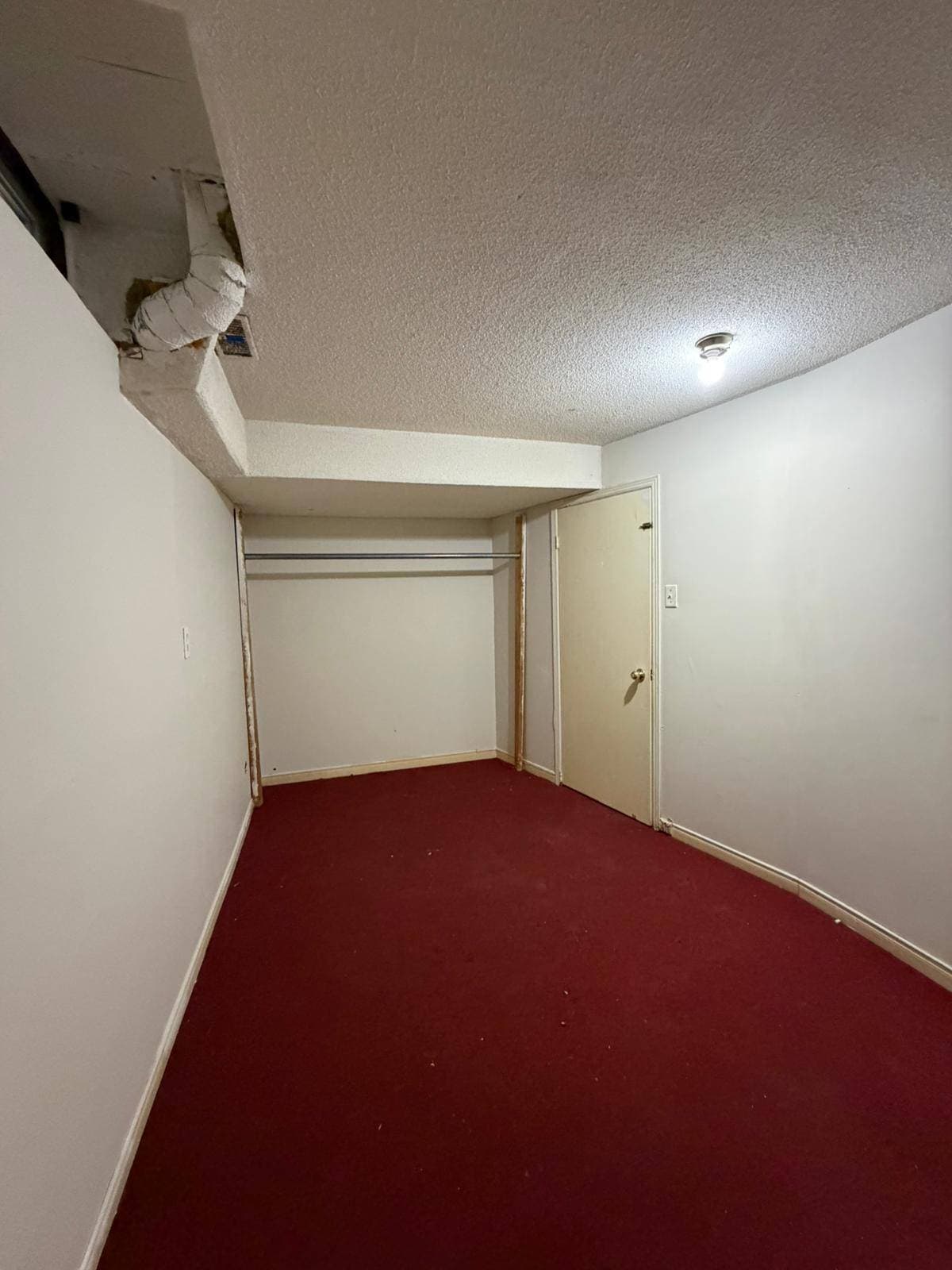 Empty Room with Red Carpet at 3 bedroom Walk out basment, a 3 bedroom rental in 151 Morton Way, Brampton, ON, listed for $2,000 per month