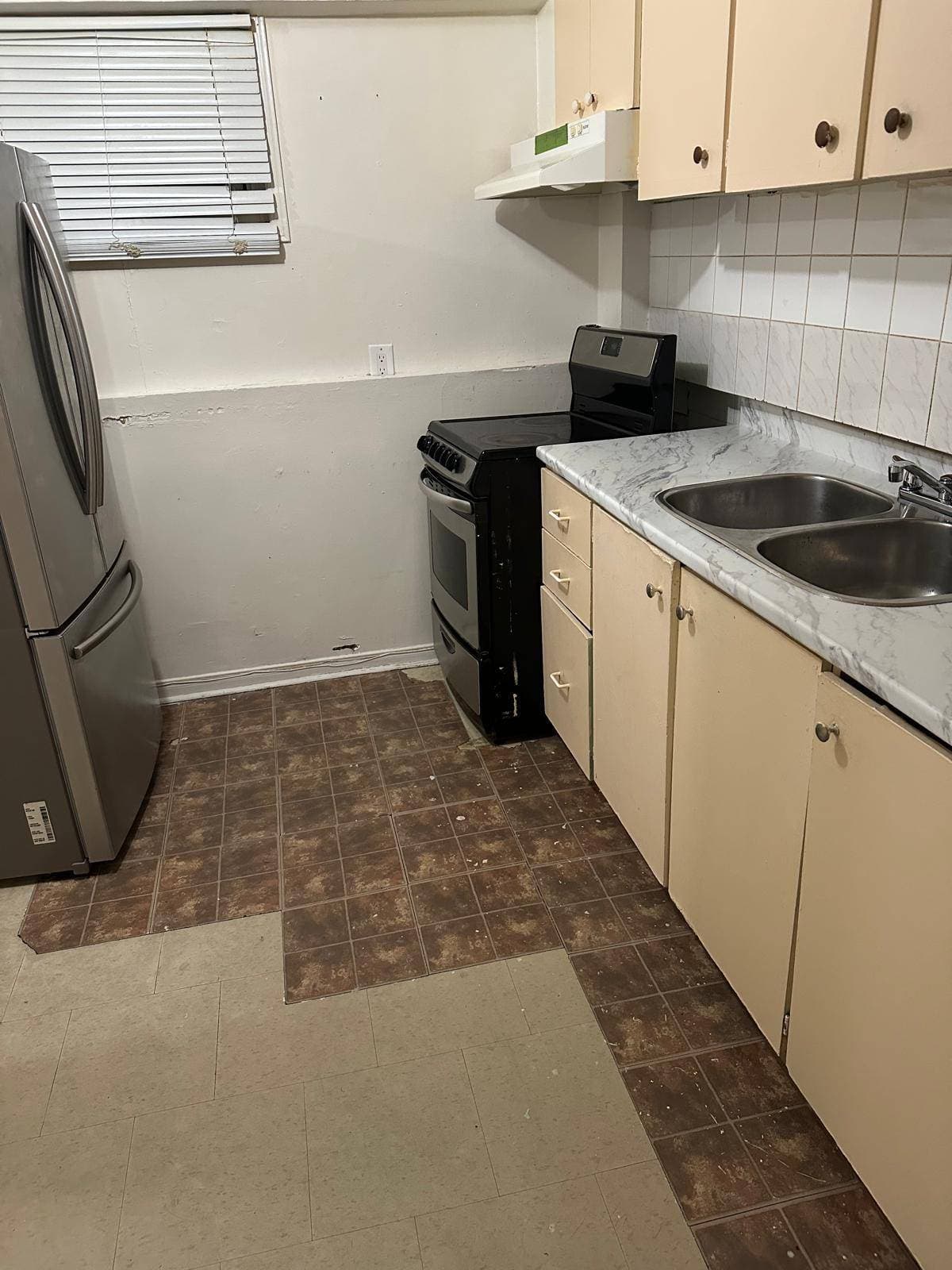Compact Kitchen with Appliances at 3 bedroom Walk out basment, a 3 bedroom rental in 151 Morton Way, Brampton, ON, listed for $2,000 per month