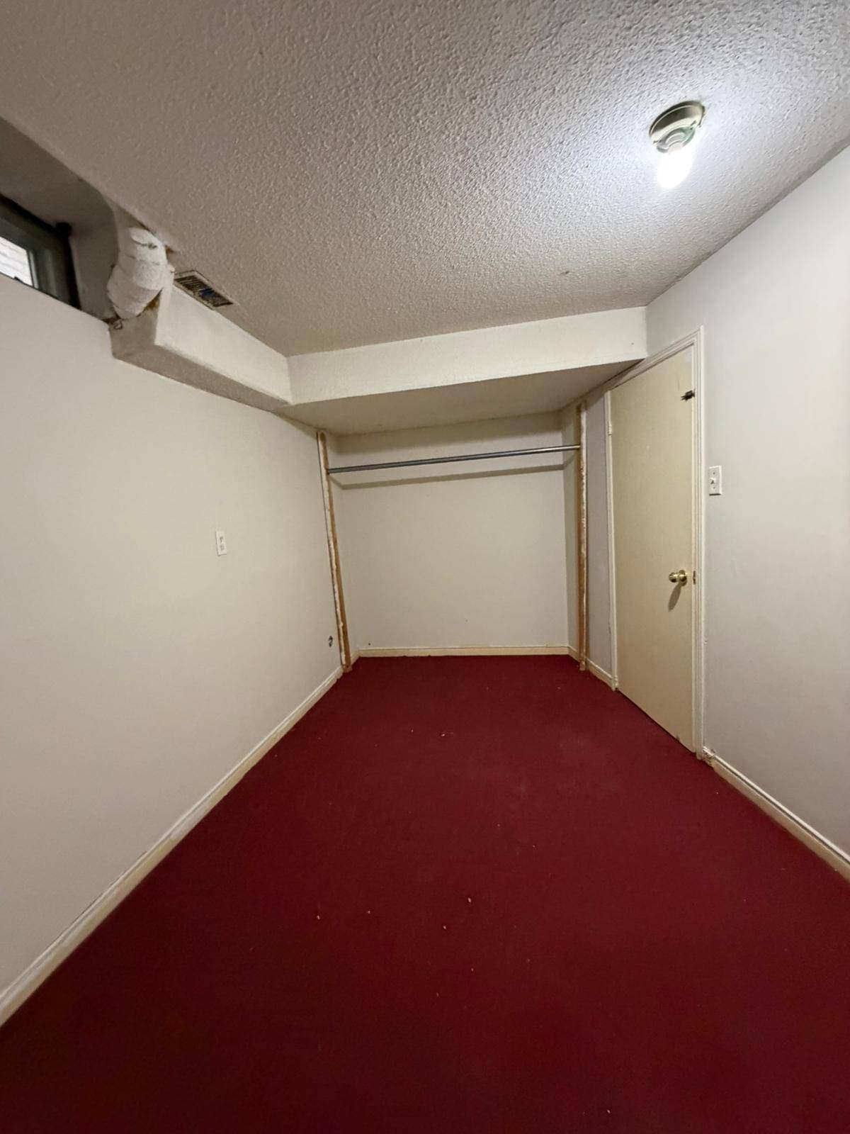Small Bedroom with Red Carpet at 3 bedroom Walk out basment, a 3 bedroom rental in 151 Morton Way, Brampton, ON, listed for $2,000 per month