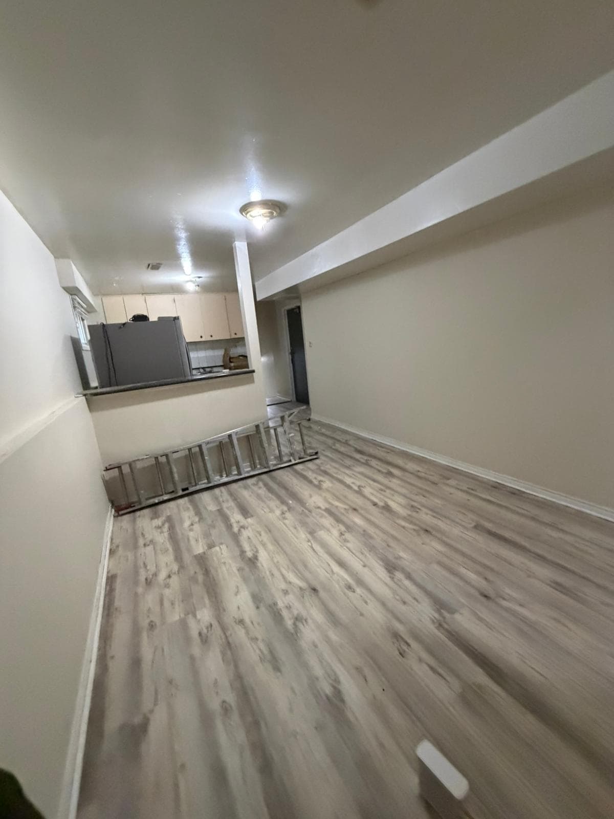Spacious Living Area with Modern Flooring at 3 bedroom Walk out basment, a 3 bedroom rental in 151 Morton Way, Brampton, ON, listed for $2,000 per month