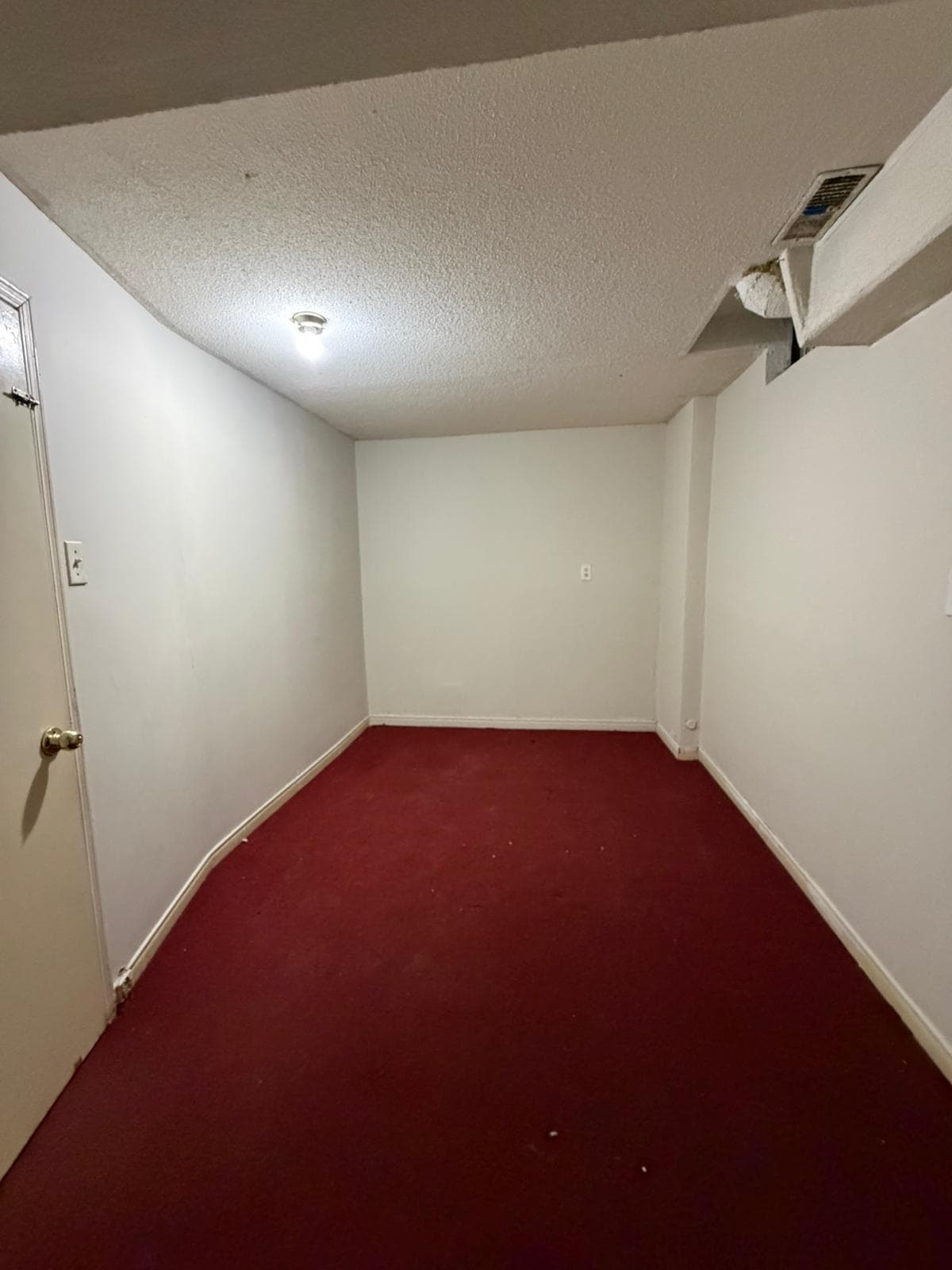 Empty Room with Red Carpet at 3 bedroom Walk out basment, a 3 bedroom rental in 151 Morton Way, Brampton, ON, listed for $2,000 per month