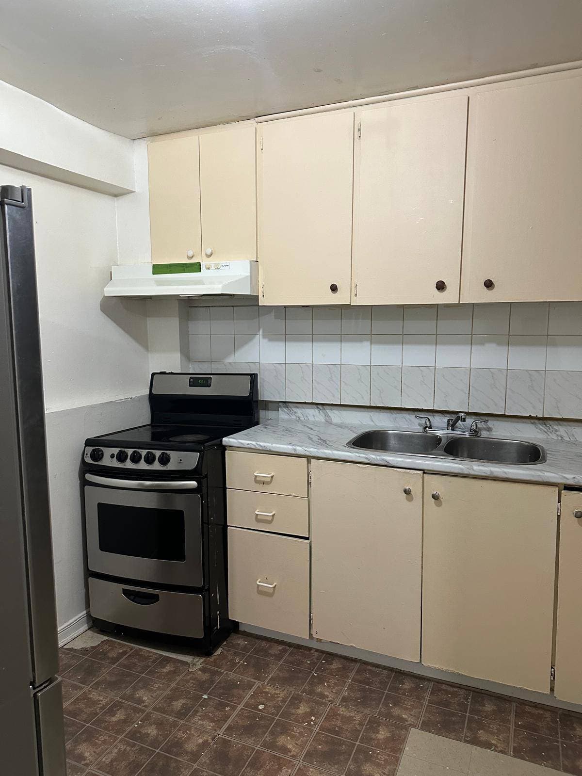 Compact Kitchen with Essentials at 3 bedroom Walk out basment, a 3 bedroom rental in 151 Morton Way, Brampton, ON, listed for $2,000 per month