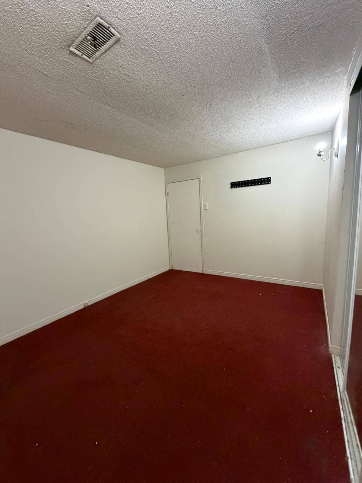 Secondary Bedroom with Red Carpet at 3 bedroom Walk out basment, a 3 bedroom rental in 151 Morton Way, Brampton, ON, listed for $2,000 per month